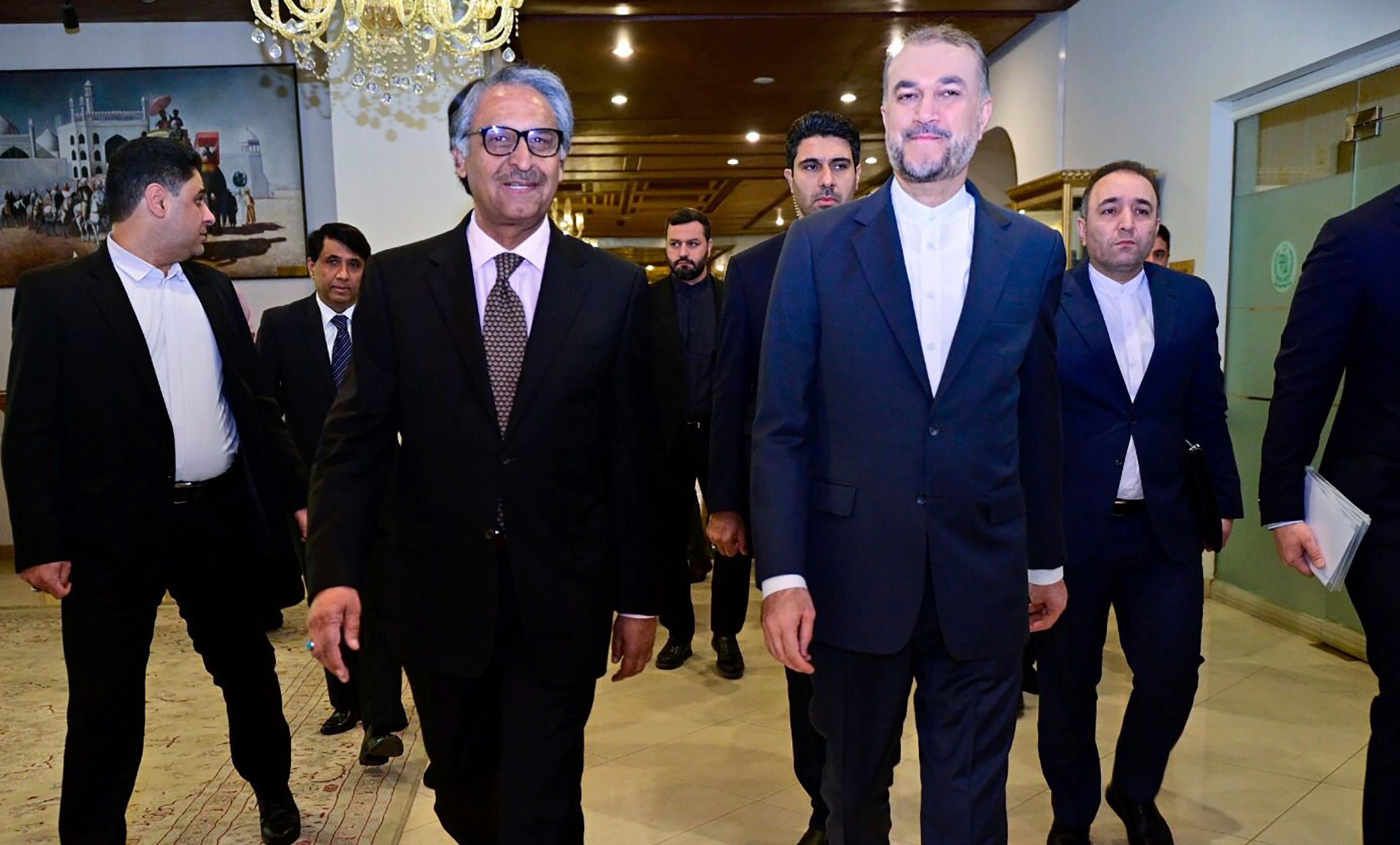 In this photo released by Pakistan's Ministry of Foreign Affairs, visiting Iran's Foreign Minister Hossein Amirabdollahian, front right, walks with his Pakistani counterpart Jalil Abbas Jilani, front left, upon his arrival for a meeting at the Ministry of Foreign Affairs in Islamabad, Pakistan, Monday, Jan. 29, 2024. Iran's foreign minister was in Pakistan for talks on deescalating tensions after deadly airstrikes by Tehran and Islamabad earlier this month killed at least 11 people, marking a significant escalation in fraught relations between the neighbors. (Ministry of Foreign Affairs via AP)