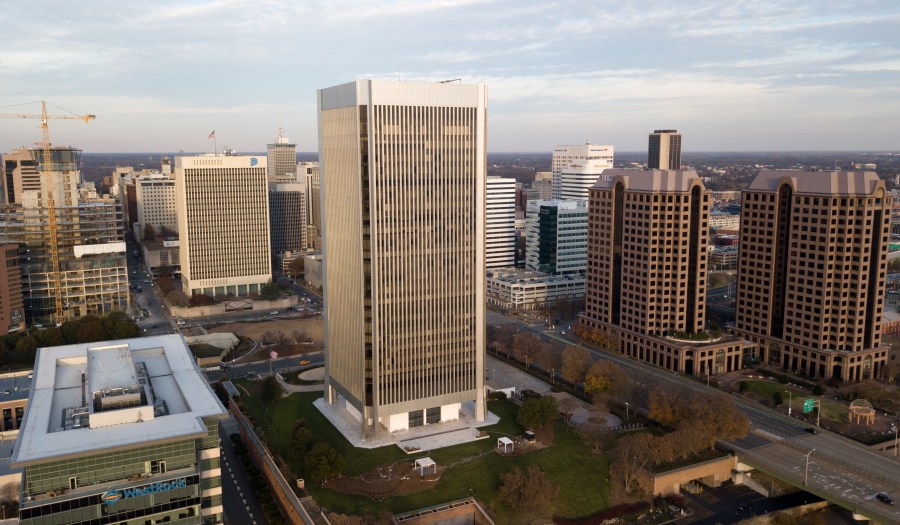 FILE - The Federal Reserve building, center, rises high over the skyline of Richmond, Va., on Dec. 4, 2017. (AP Photo/Steve Helber, File)