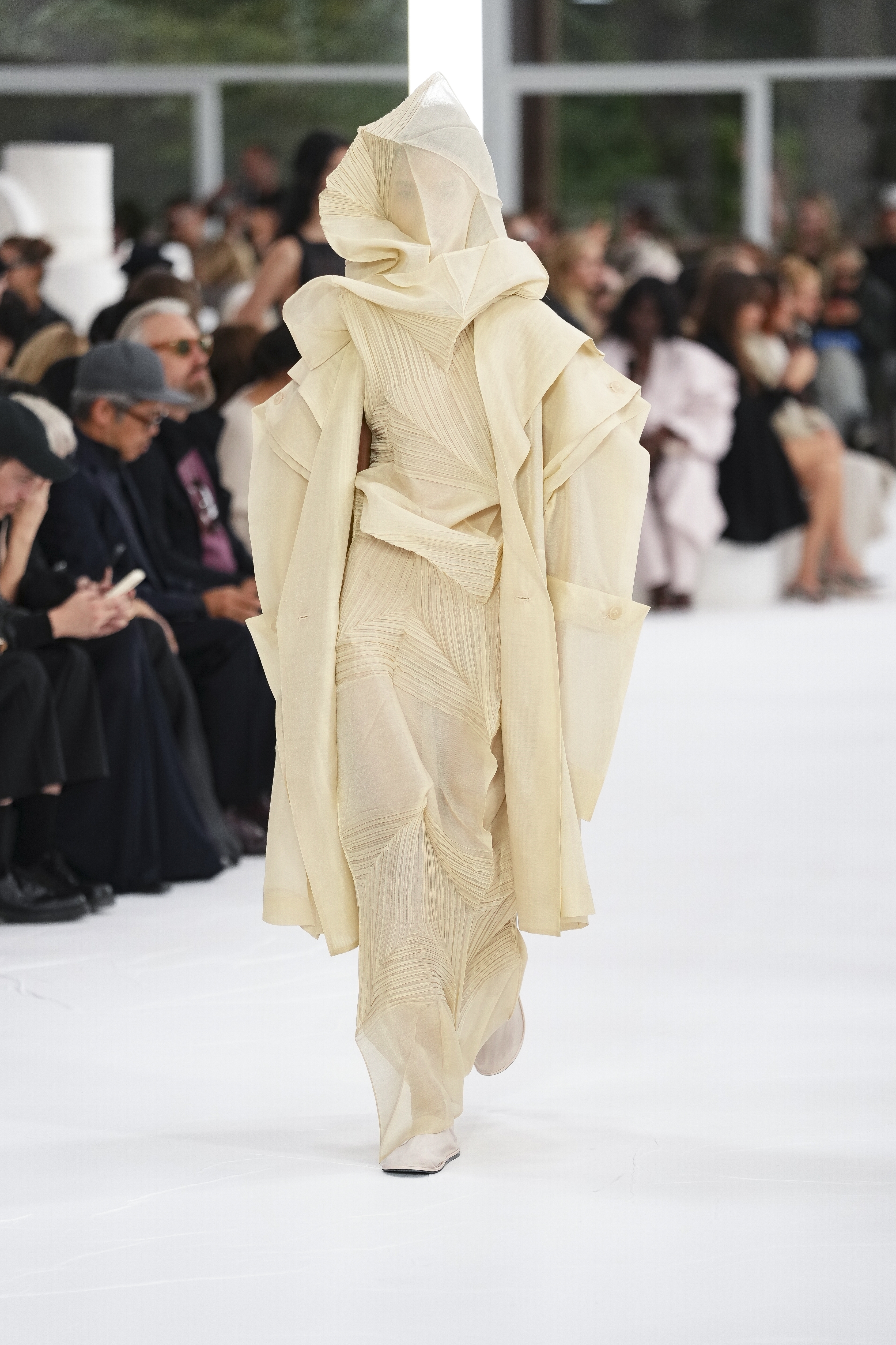 A model wears a creation as part of the Issey Miyake Spring/Summer 2025 collection presented Friday, Sept. 27, 2024 in Paris. (Photo by Scott A Garfitt/Invision/AP)