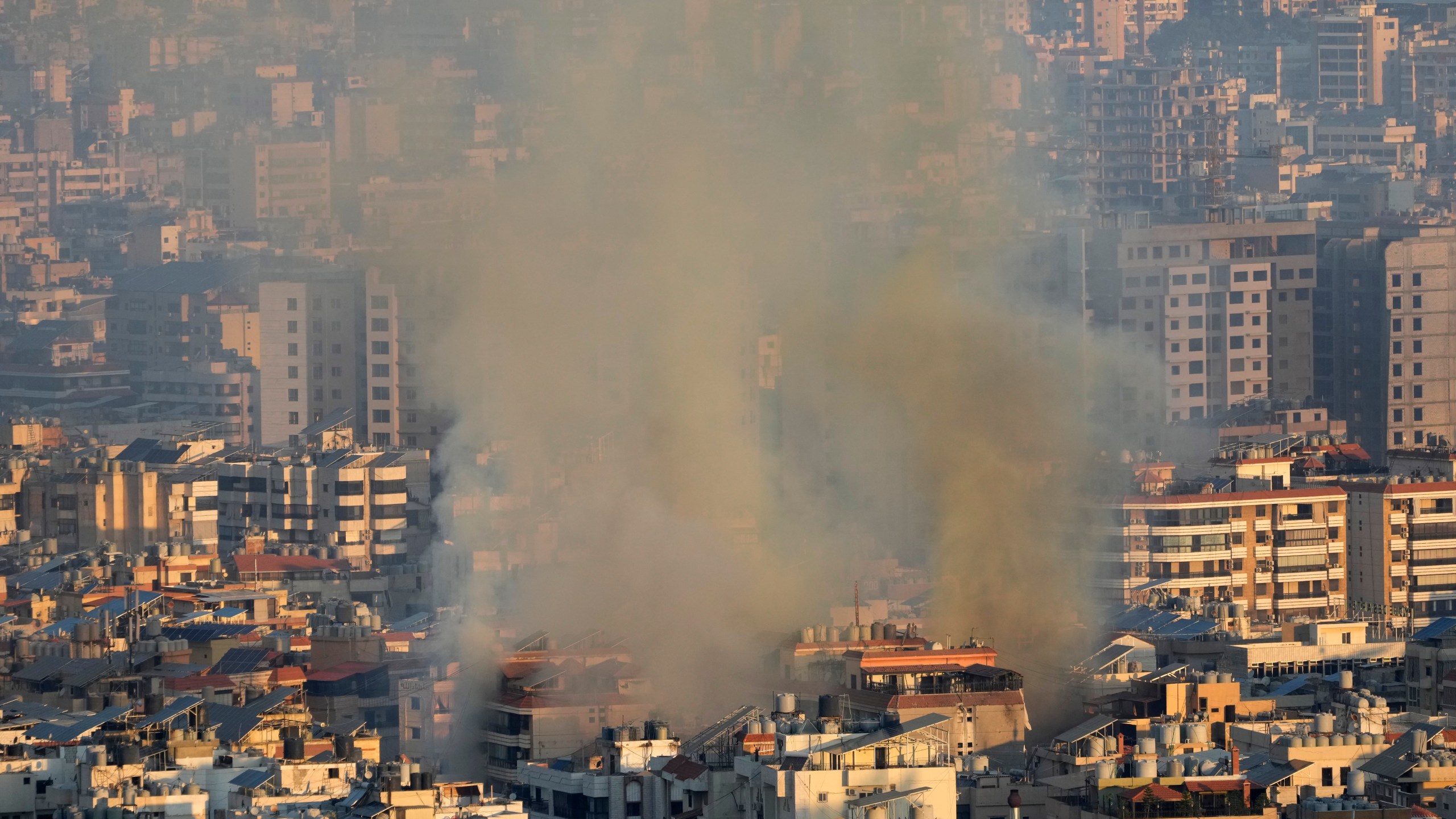 Smoke rises from an Israeli airstrike in the southern suburbs of Beirut, Lebanon, Saturday, Sept. 28, 2024. (AP Photo/Hussein Malla)