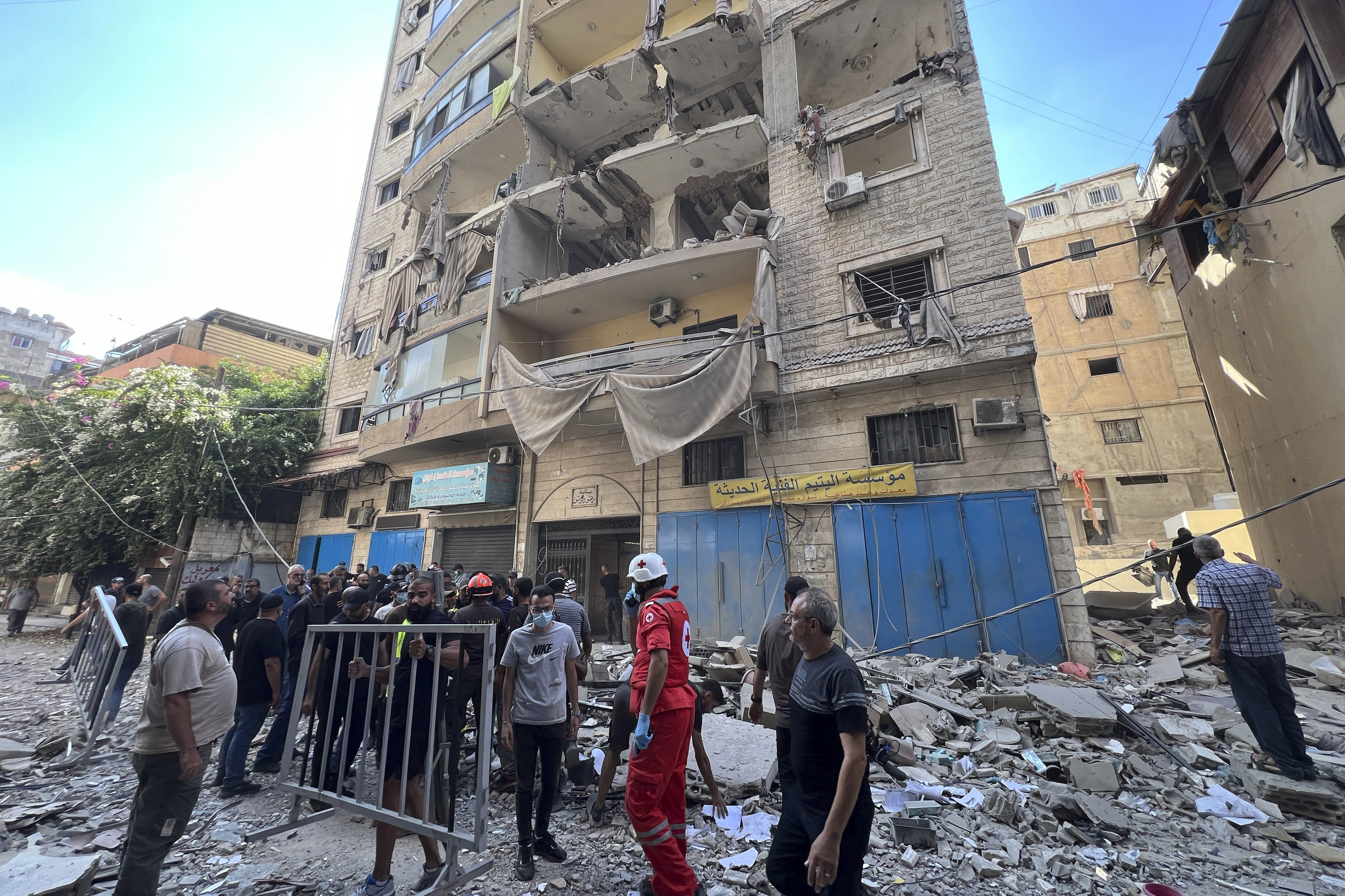 Rescuers arrive at the scene of an Israeli airstrike in Beirut's suburb of Ghobeiri, Sunday, Sept. 29, 2024. (AP Photo/Hussein Malla)