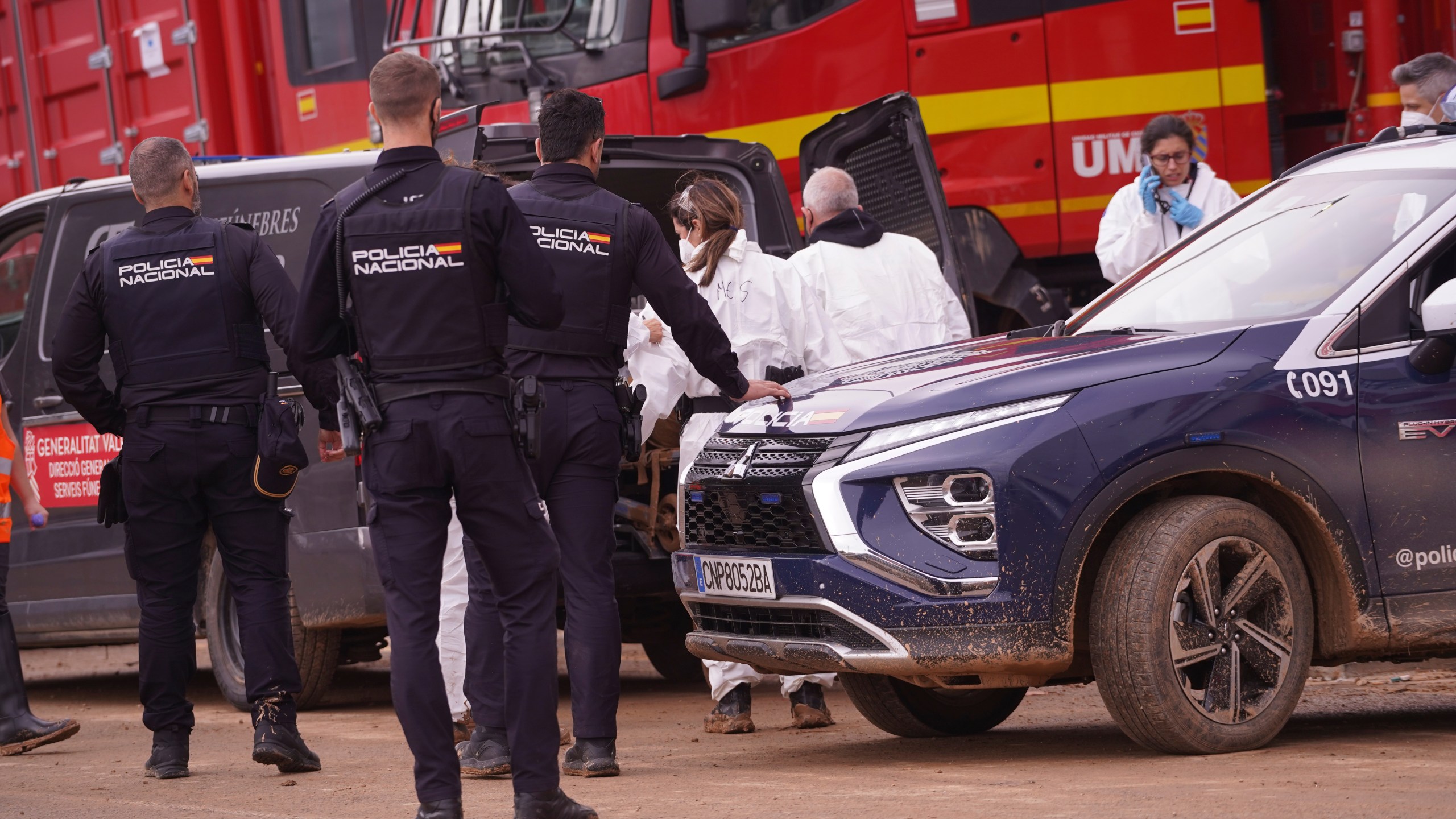 A body found in the MN4 shopping centre on the outskirts of Valencia, Spain is placed in a funeral van after floods in the Valencia area, Monday, Nov. 4, 2024. (AP Photo/Alberto Saiz)