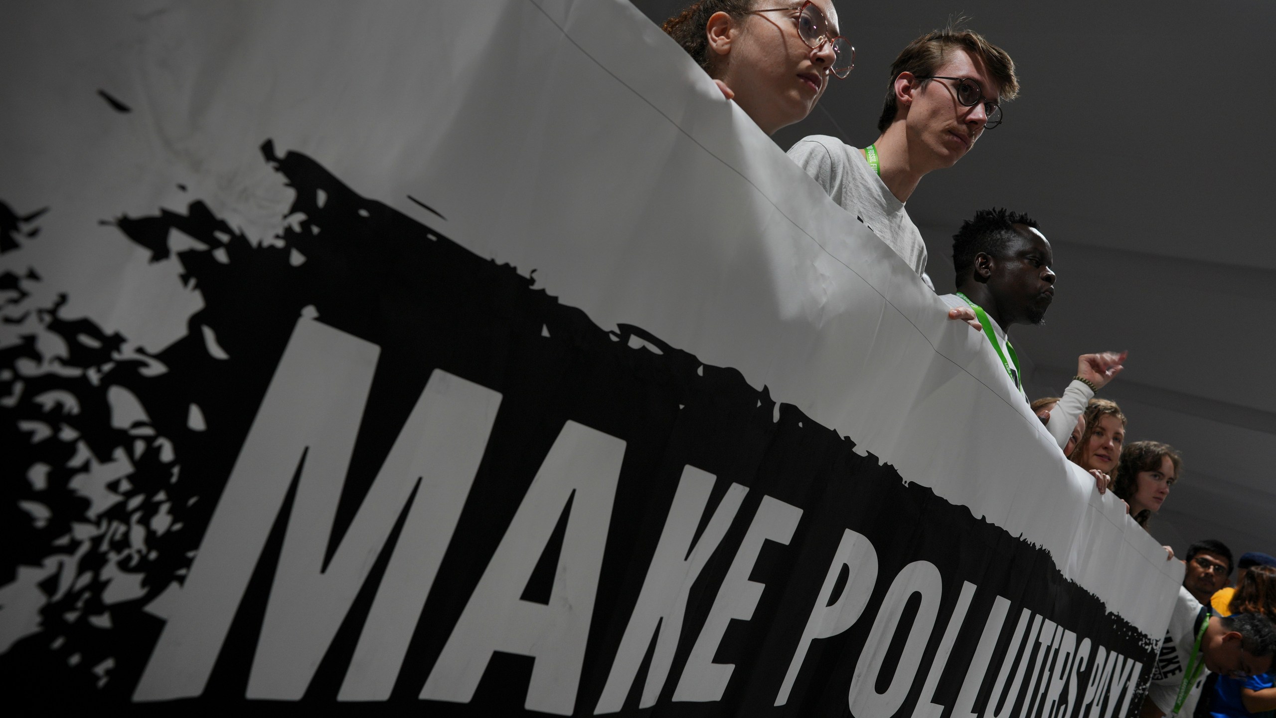 Activists participate in a demonstration for climate finance at the COP29 U.N. Climate Summit, Saturday, Nov. 16, 2024, in Baku, Azerbaijan. (AP Photo/Peter Dejong)