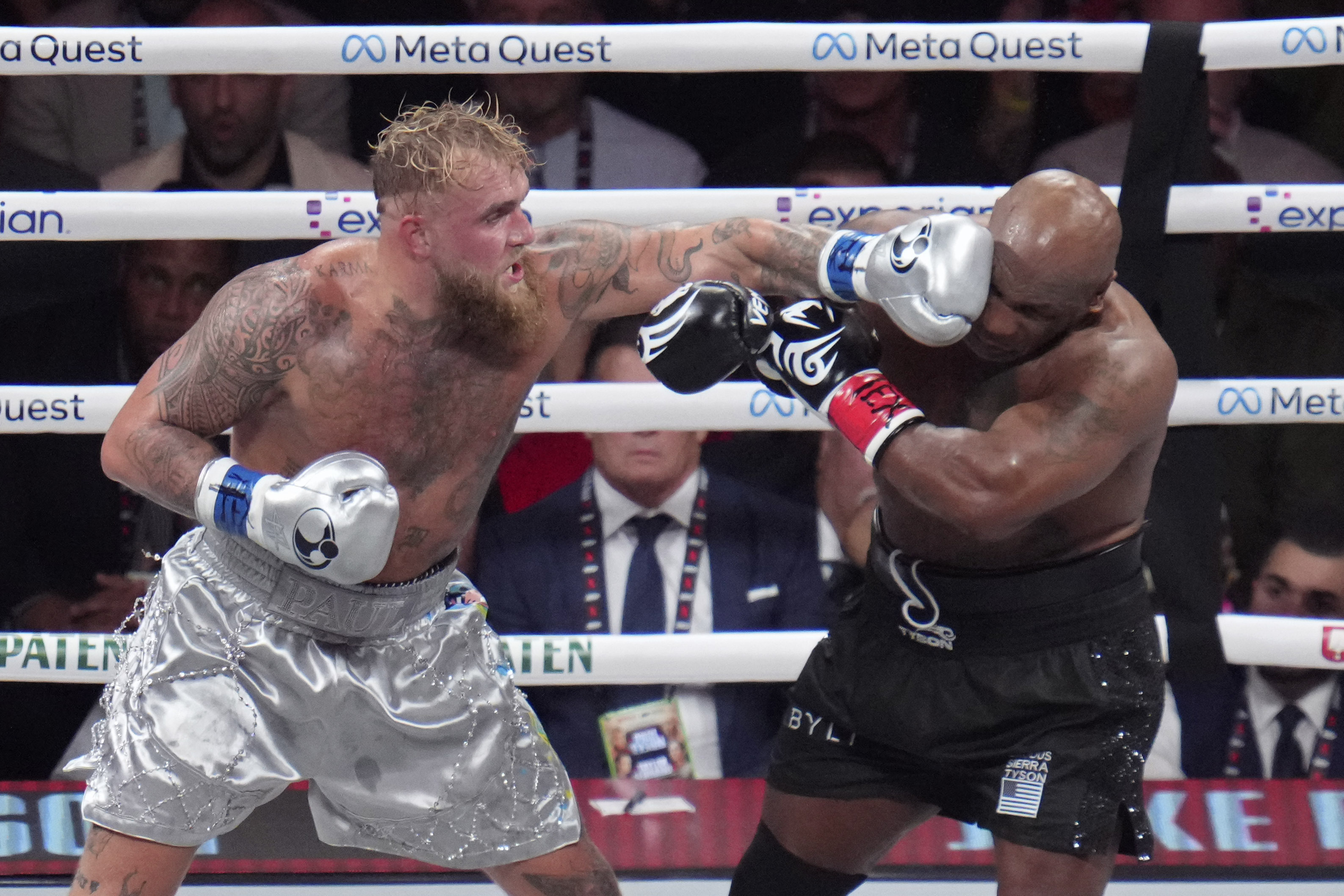 Jake Paul lands a left to Mike Tyson during their heavyweight boxing match, Friday, Nov. 15, 2024, in Arlington, Texas. (AP Photo/Julio Cortez)