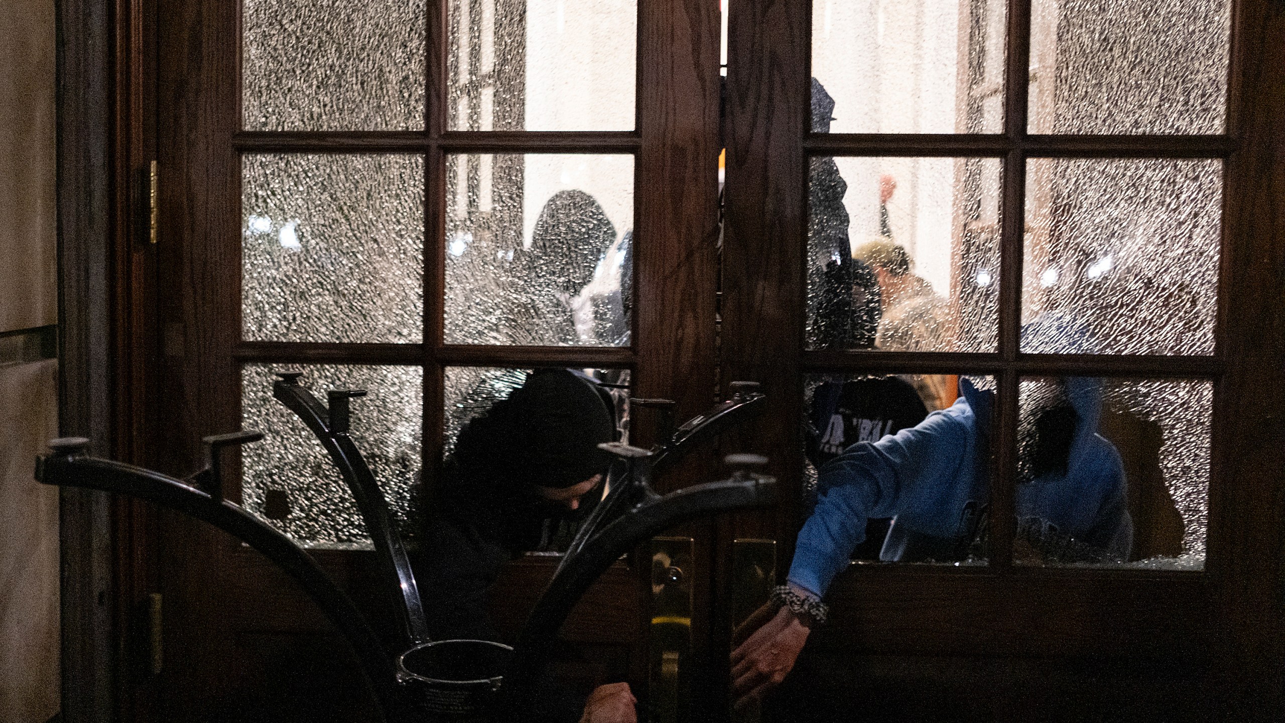 FILE - Students with the Gaza Solidarity Encampment block the entrance of Hamilton Hall at Columbia University after taking over it, April 30, 2024 in New York. (Marco Postigo Storel via AP, File)