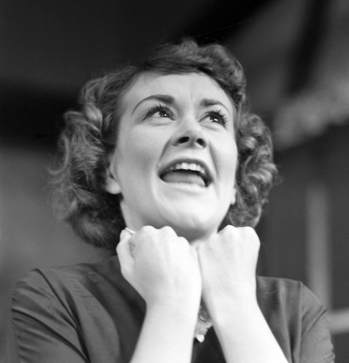 FILE - Actress Joan Plowright is shown during a dress rehearsal for the play Roots at the Royal Court Theatre in London, on June 28, 1960. The play, second of the Wesker trilogy, was presented by the English stage company and opened at the Royal Court that evening. (AP Photo/Bob Dear, File)