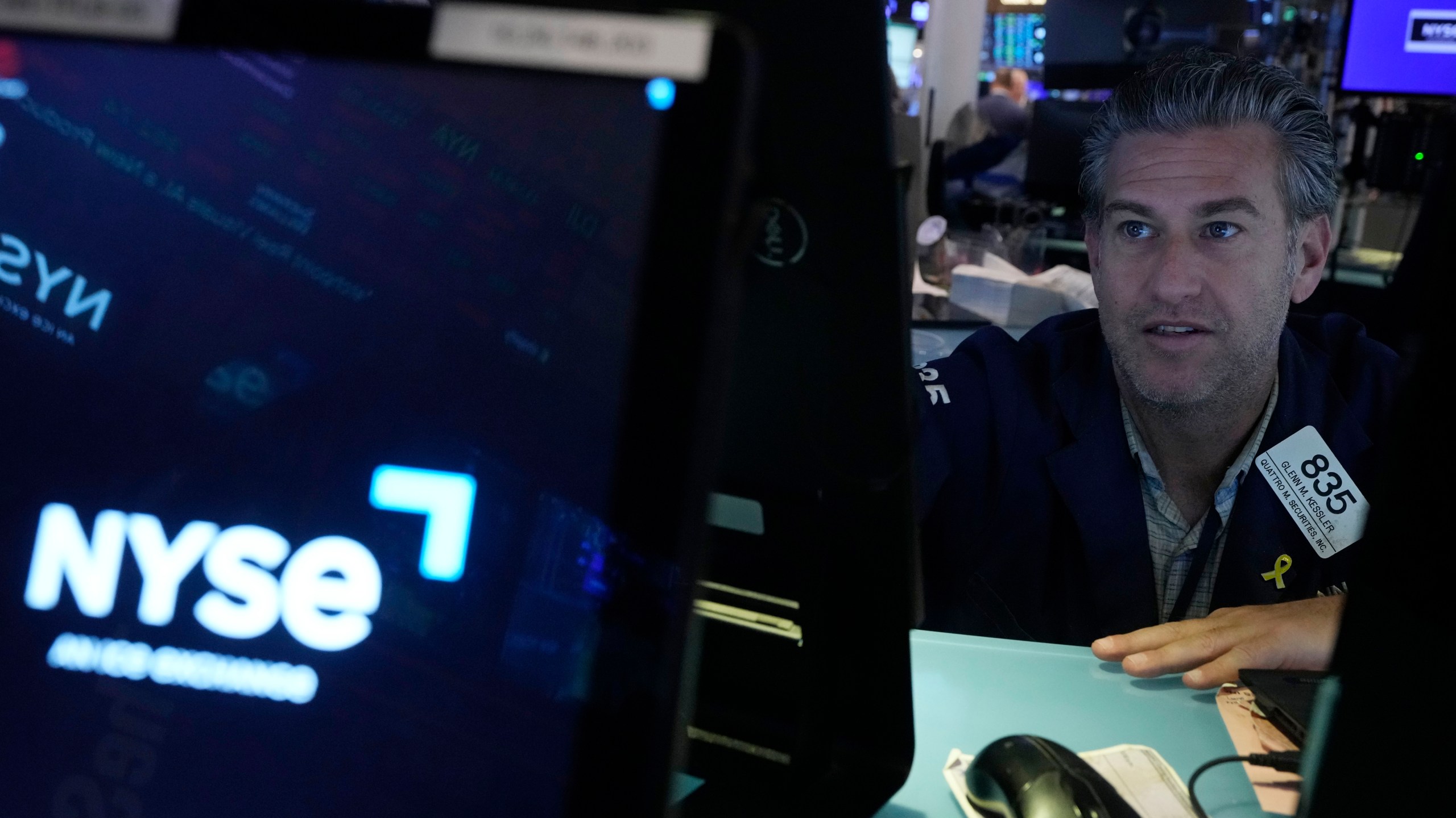 Trader Glenn Kessler works on the floor of the New York Stock Exchange, Wednesday, Dec. 18, 2024. (AP Photo/Richard Drew)