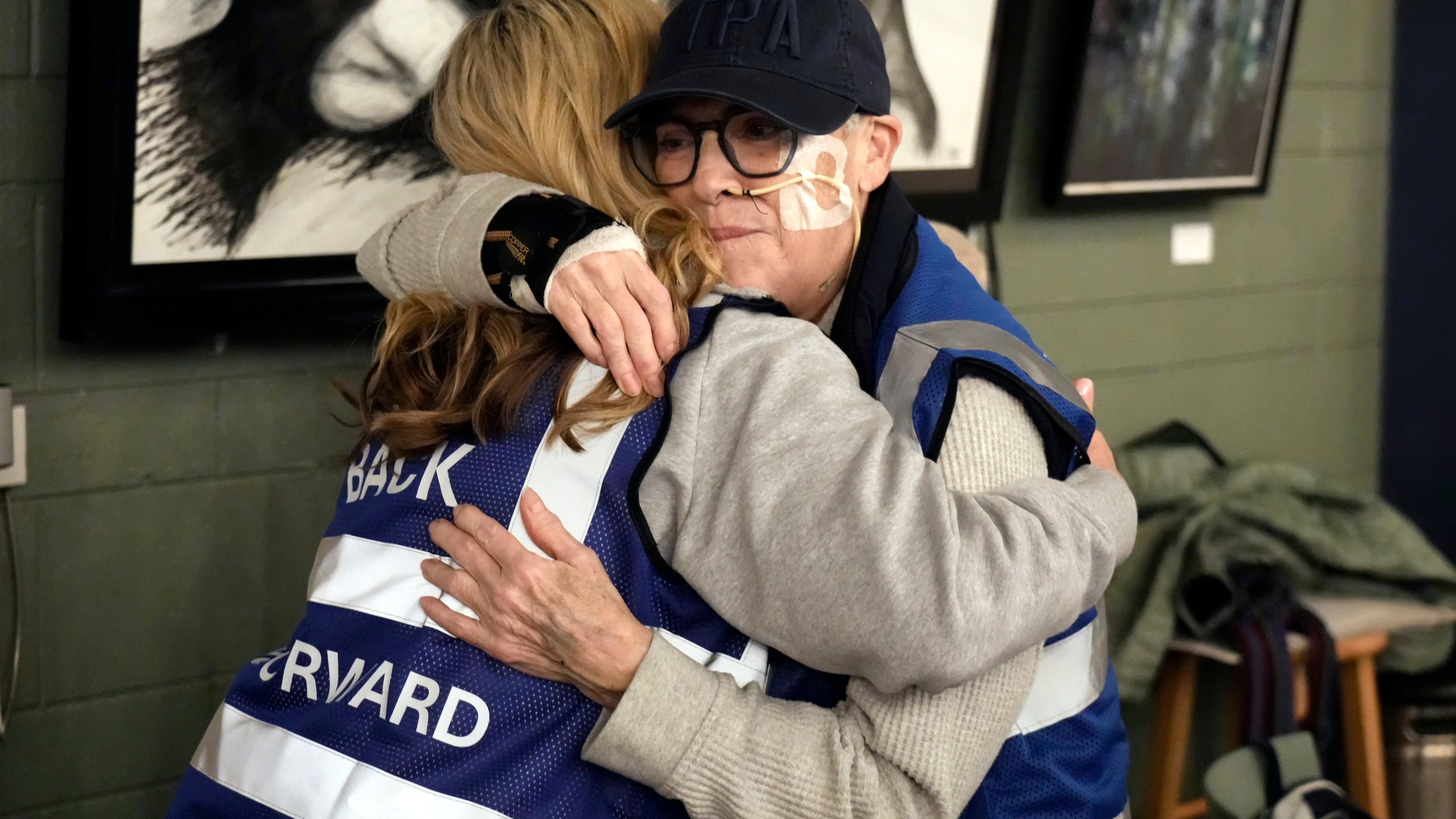 Ann Marie Dooley, left, hugs Kathy Fruge during a meeting of NC Forward in High Point, N.C., Tuesday, Jan. 14, 2025. The group is traveling to Washington to take part in the People's March on Jan. 18 ahead of the inauguration. (AP Photo/Chuck Burton)