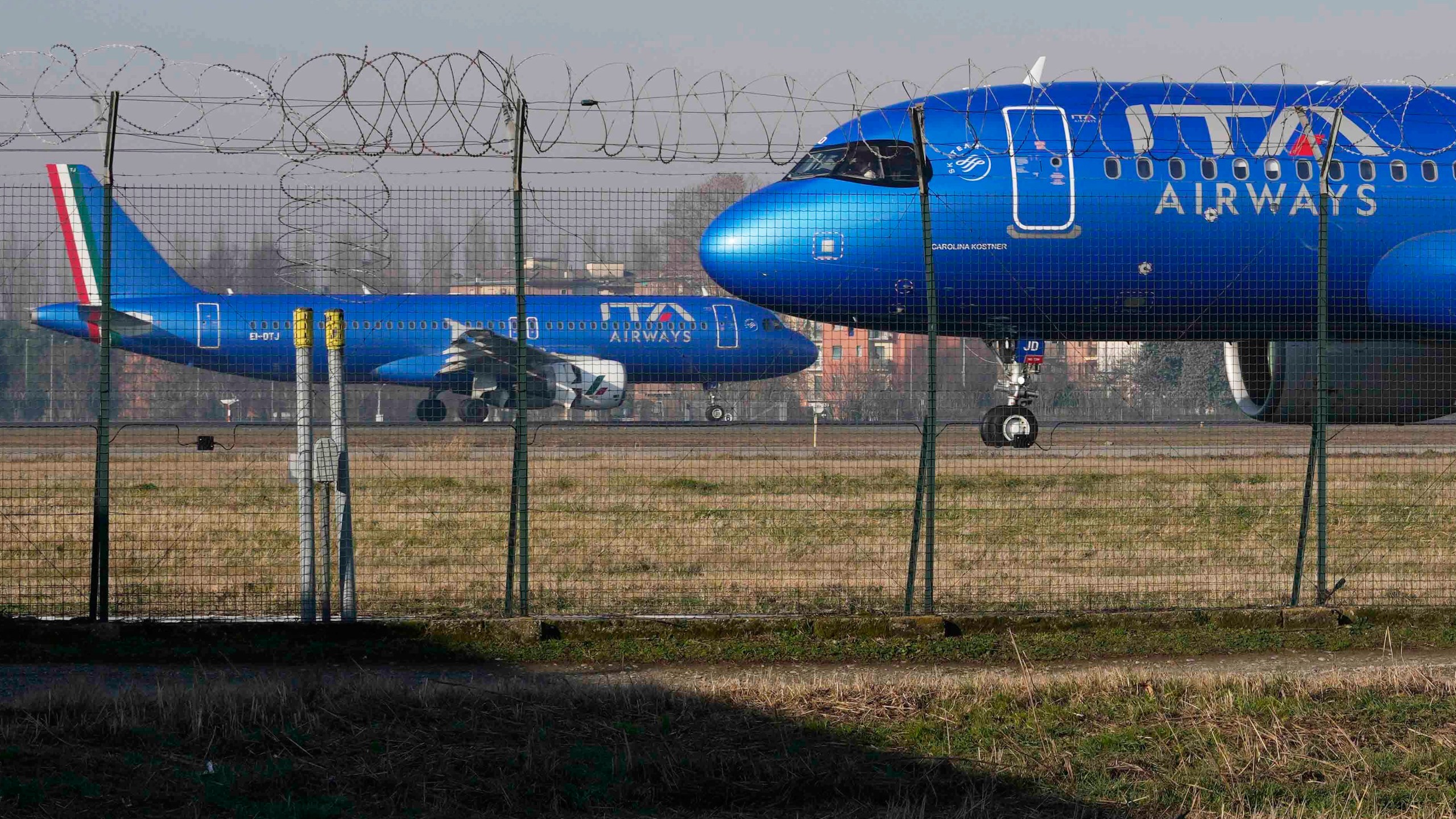 FILE - ITA Airways aircraft stand by on the tarmac before taking off from Linate airport in Milan, Italy, Wednesday, Jan. 24, 2024. (AP Photo/Luca Bruno, File)