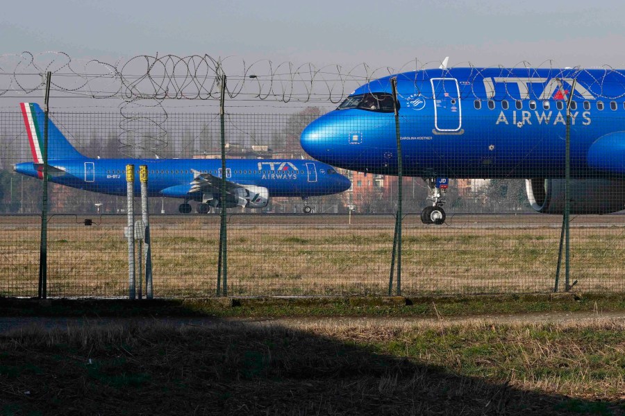 FILE - ITA Airways aircraft stand by on the tarmac before taking off from Linate airport in Milan, Italy, Wednesday, Jan. 24, 2024. (AP Photo/Luca Bruno, File)