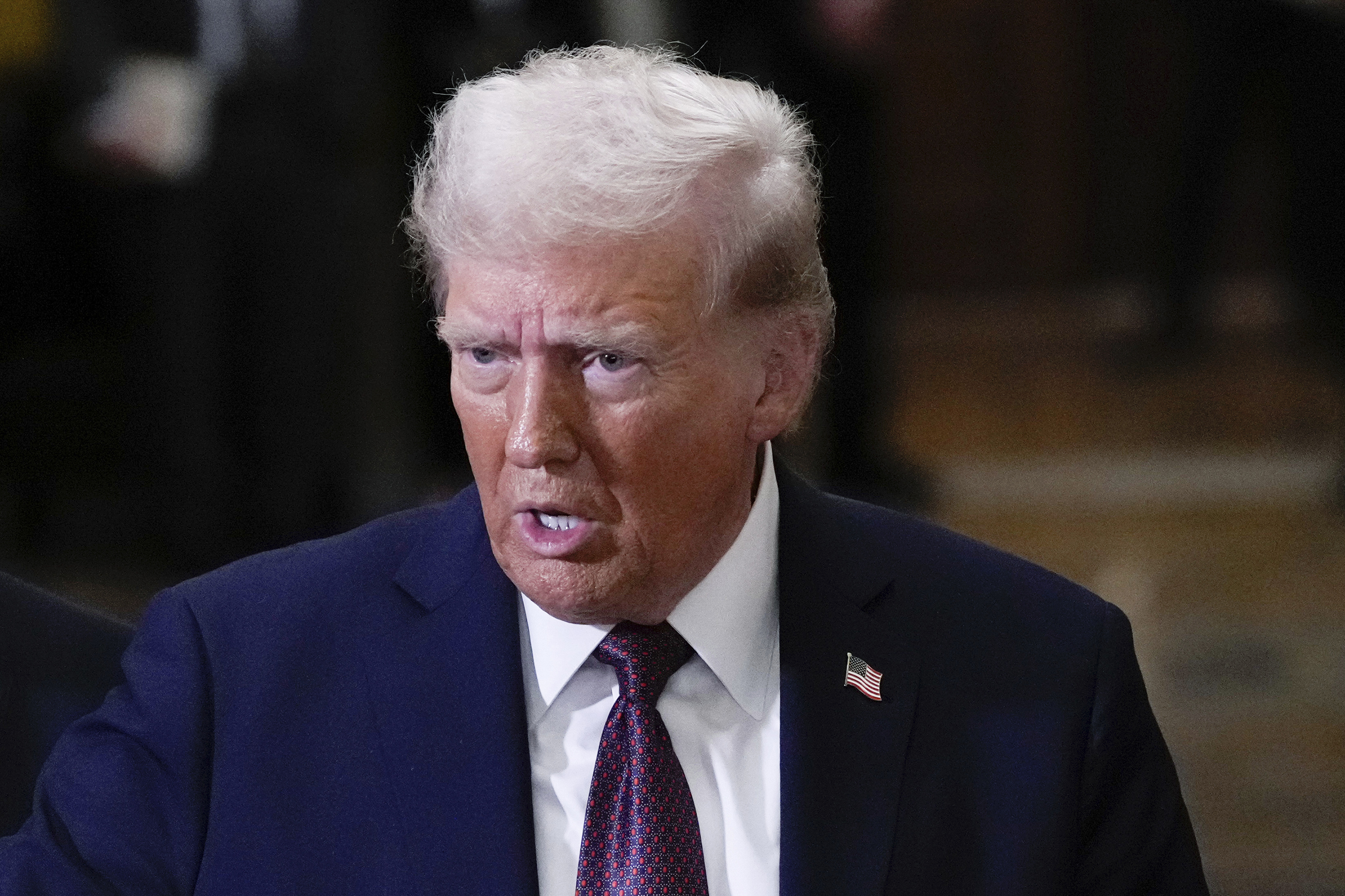 FILE - President-elect Donald Trump talks to reporters after a meeting with Republican leadership at the Capitol on Wednesday, Jan. 8, 2025, in Washington. (AP Photo/Steve Helber, File)