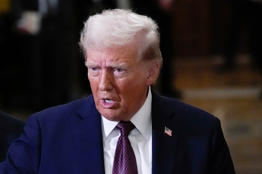 FILE - President-elect Donald Trump talks to reporters after a meeting with Republican leadership at the Capitol on Wednesday, Jan. 8, 2025, in Washington. (AP Photo/Steve Helber, File)