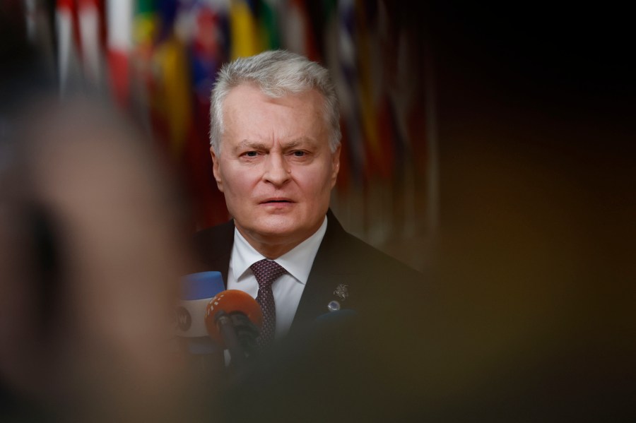 Lithuania's President Gitanas Nauseda speaks with the media as he arrives for an EU summit at the European Council building in Brussels, Thursday, Dec. 19, 2024. (AP Photo/Geert Vanden Wijngaert)