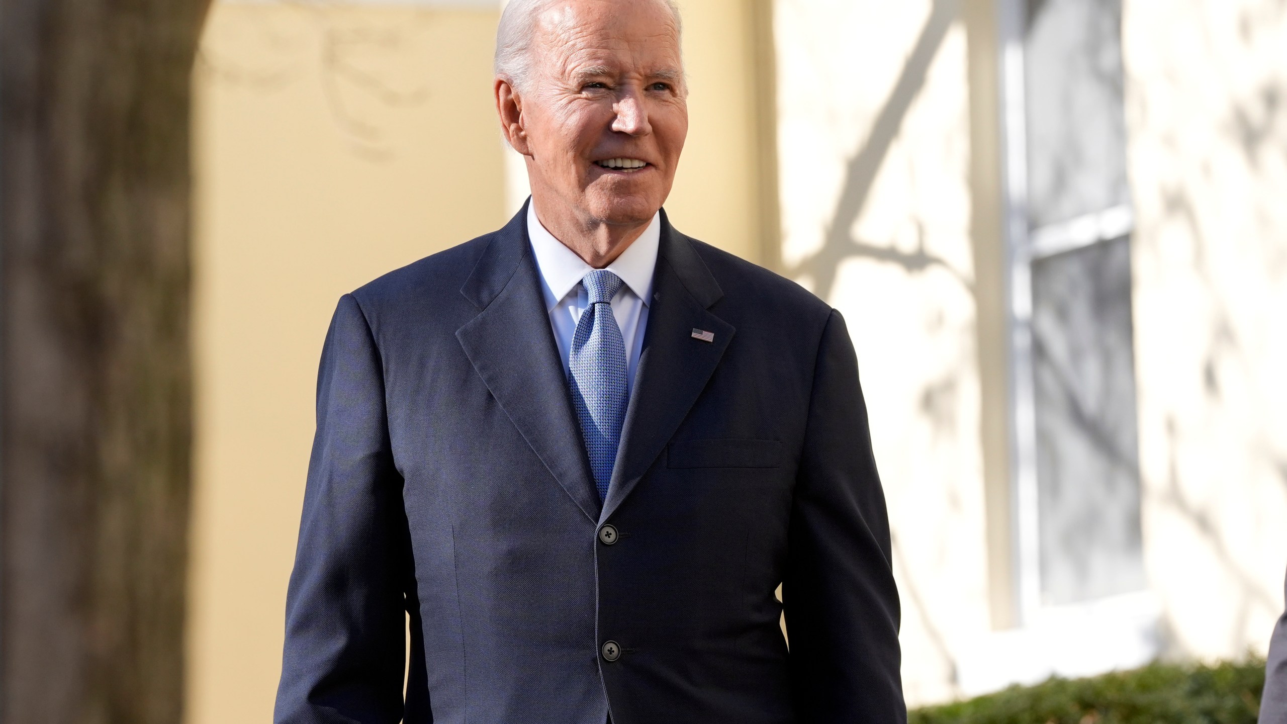 President Joe Biden listens to a question from a reporter after walking out of St. John's Church in Washington, Friday, Jan. 17, 2025. (AP Photo/Alex Brandon)