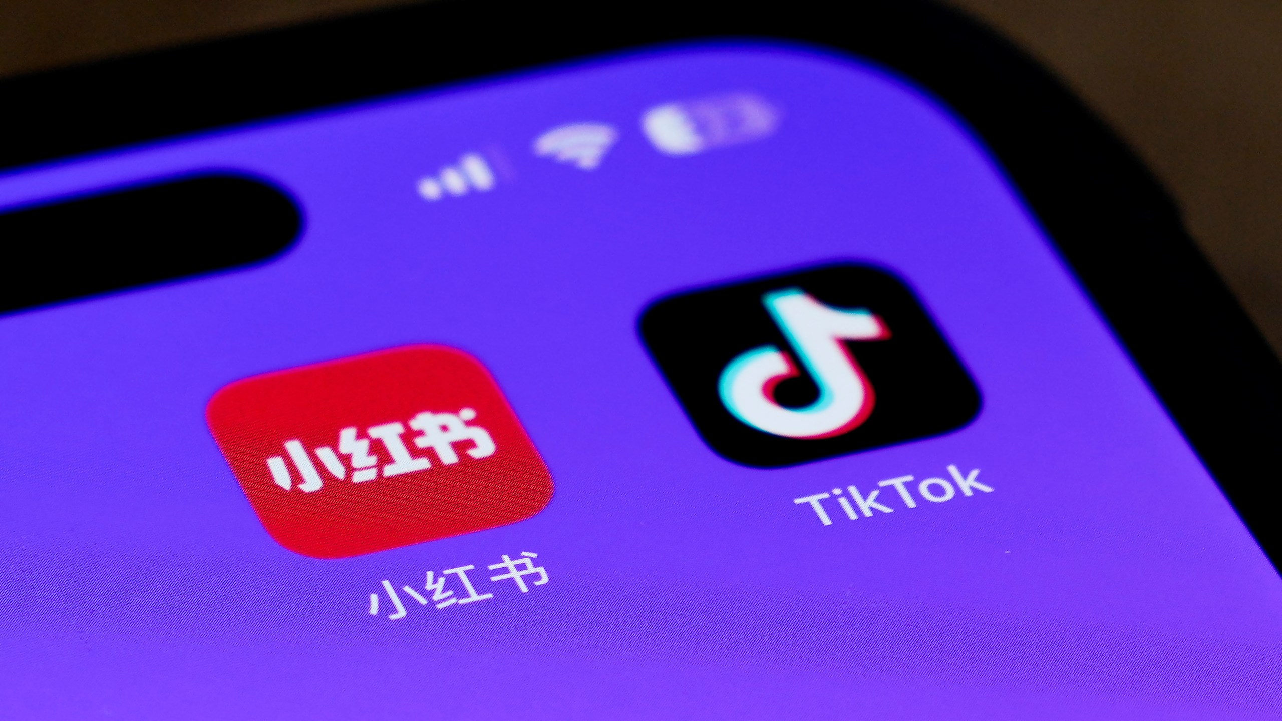 Icons for the smartphone apps Xiaohongshu and TikTok are seen on a smartphone screen in Beijing, Tuesday, Jan. 14, 2025. (AP Photo/Andy Wong)