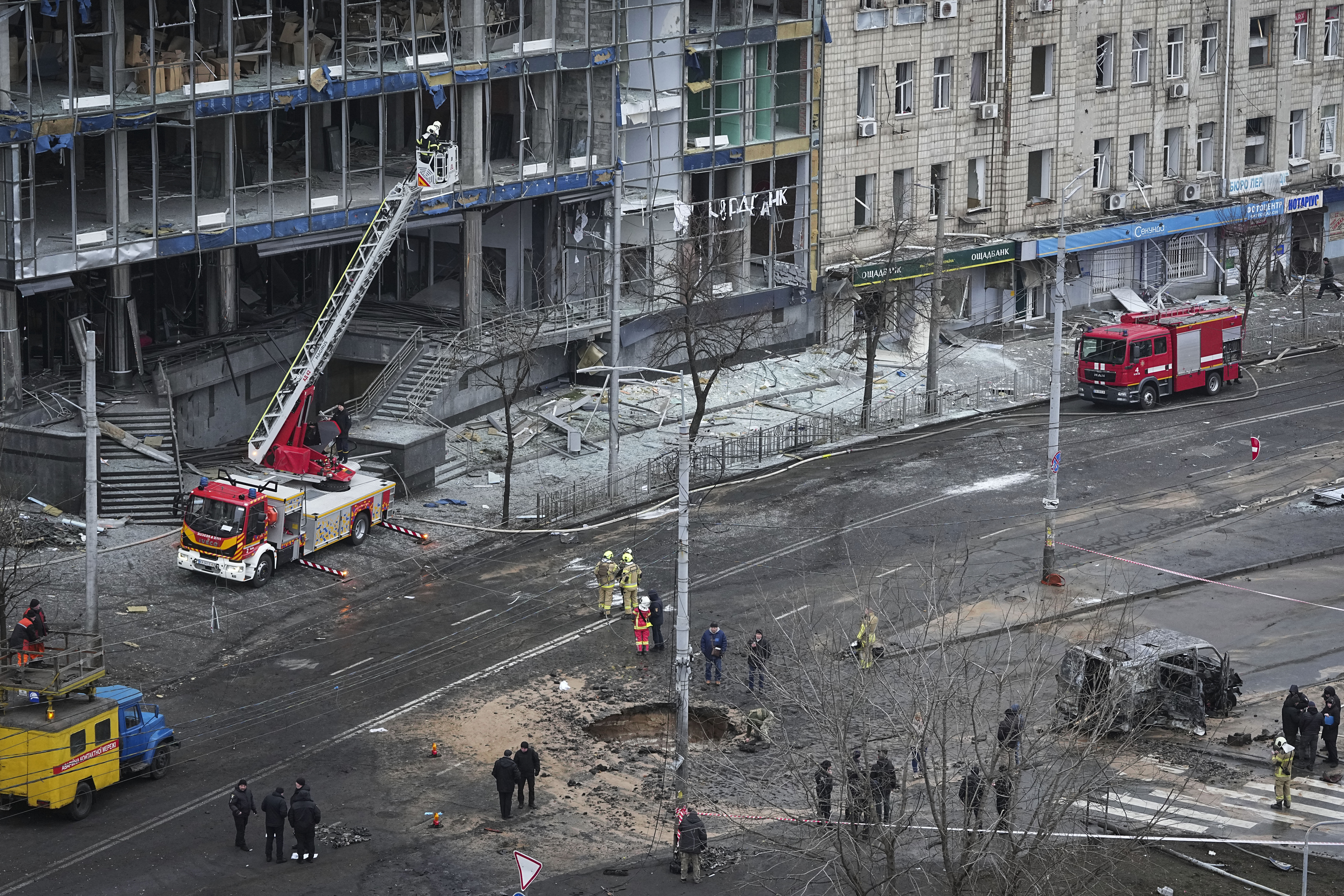 Firefighters work on the site of a damaged building after a Russian missile attack in Kyiv, Ukraine, Saturday, Jan. 18, 2025. (AP Photo/Efrem Lukatsky)