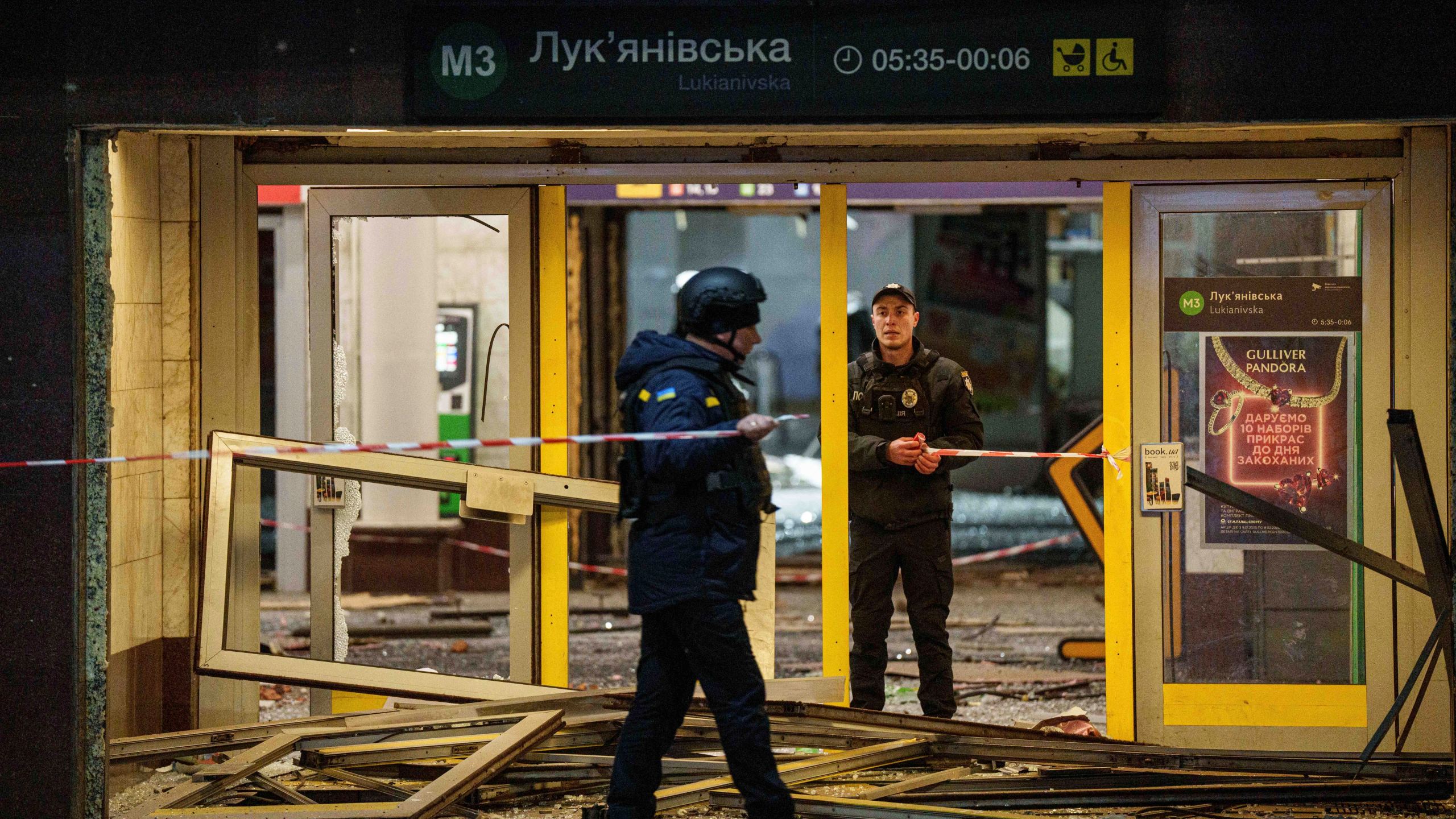 Police officers rope off the entrance to a metro station after a Russian missile strike on Kyiv, Ukraine, Saturday, Jan. 18, 2024. (AP Photo/Evgeniy Maloletka)