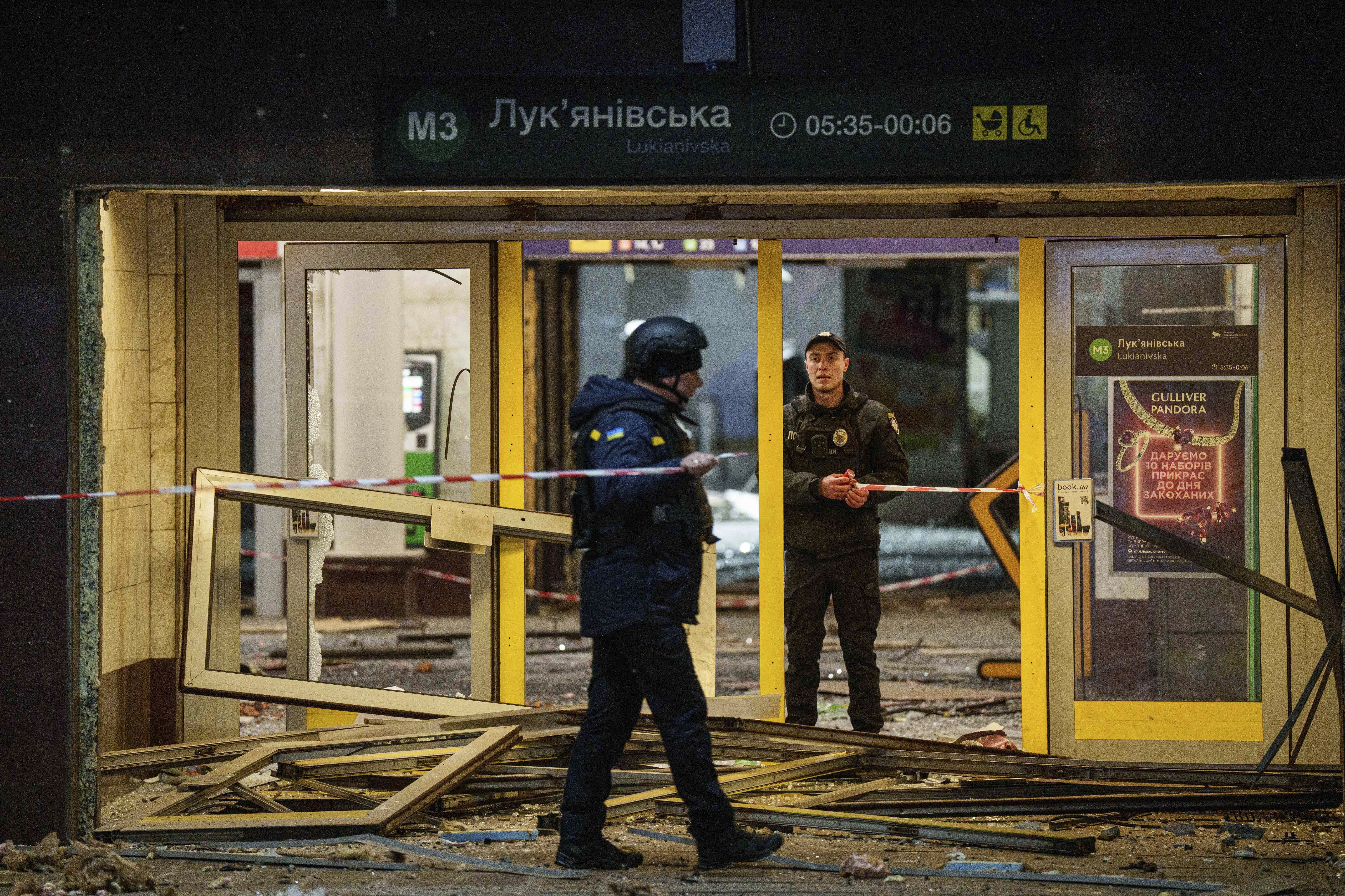 Police officers rope off the entrance to a metro station after a Russian missile strike on Kyiv, Ukraine, Saturday, Jan. 18, 2024. (AP Photo/Evgeniy Maloletka)