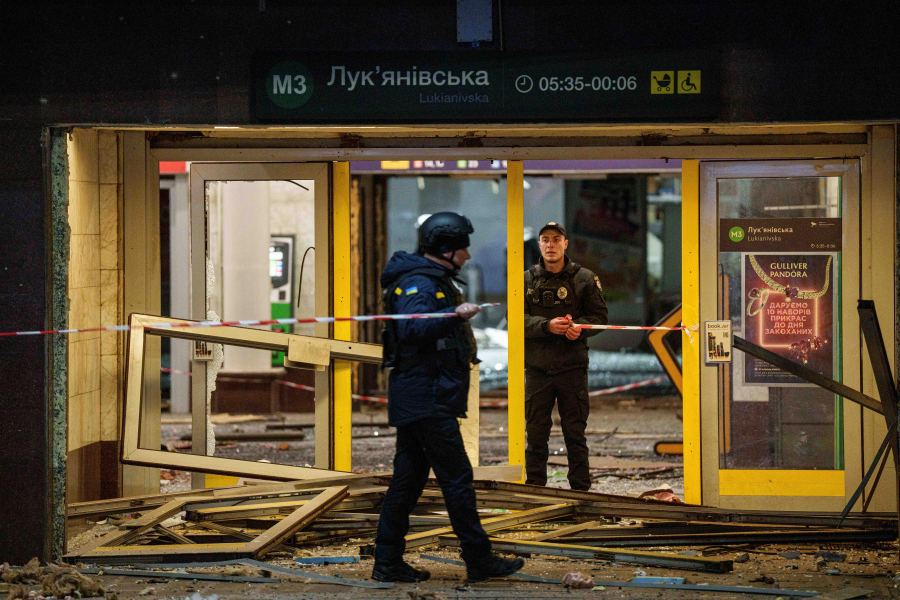 Police officers rope off the entrance to a metro station after a Russian missile strike on Kyiv, Ukraine, Saturday, Jan. 18, 2024. (AP Photo/Evgeniy Maloletka)