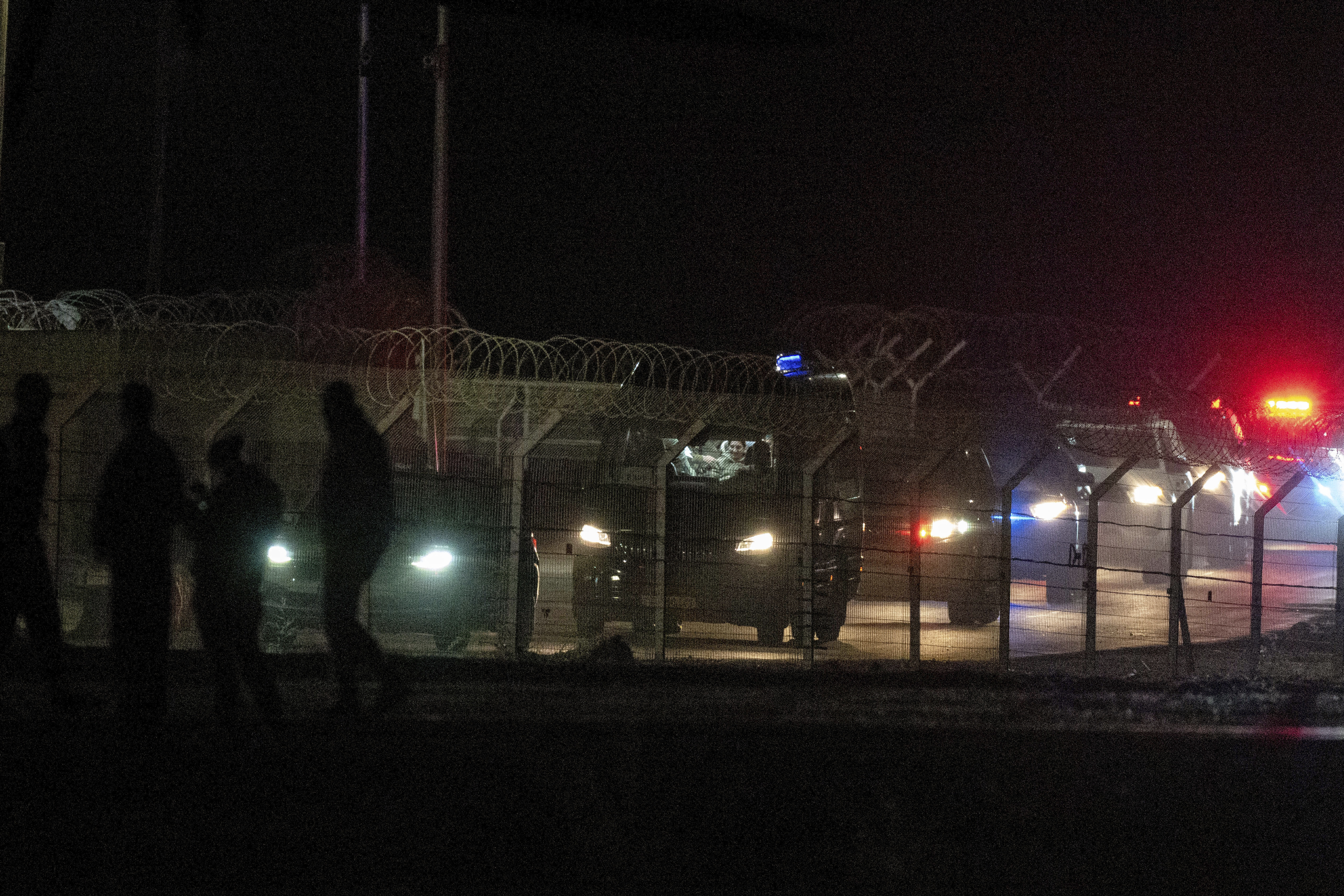 A convoy of vans and military vehicles carrying the released hostages from Gaza, arrives at a military base in southern Israel, Sunday, Jan. 19, 2025. (Photo/Ohad Zwigenberg)