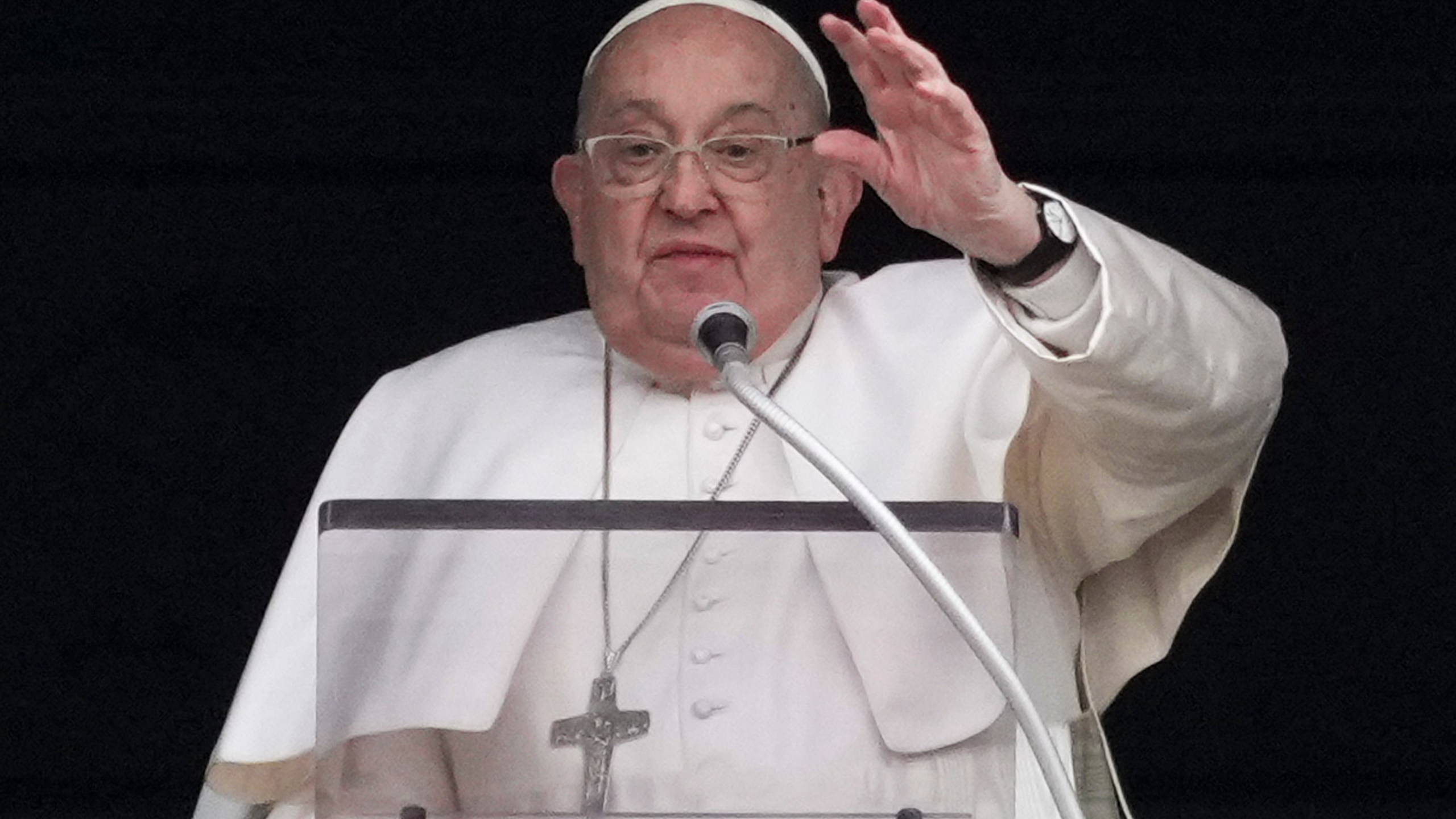 Pope Francis delivers his blessing as he recites the Angelus noon prayer from the window of his studio overlooking St.Peter's Square, at the Vatican, Sunday, Jan. 19, 2025. (AP Photo/Andrew Medichini)