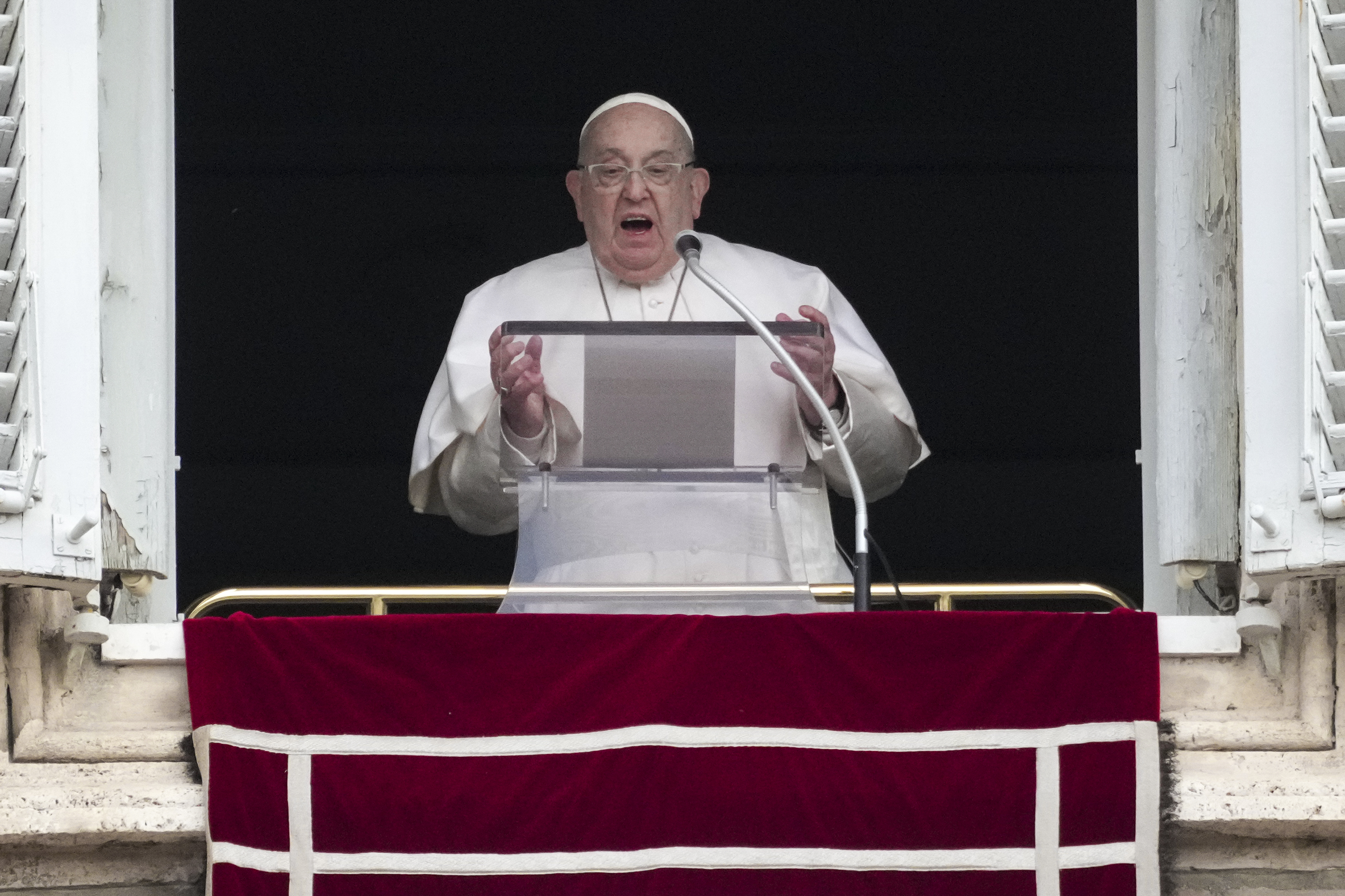 Pope Francis delivers his blessing as he recites the Angelus noon prayer from the window of his studio overlooking St.Peter's Square, at the Vatican, Sunday, Jan. 19, 2025. (AP Photo/Andrew Medichini)