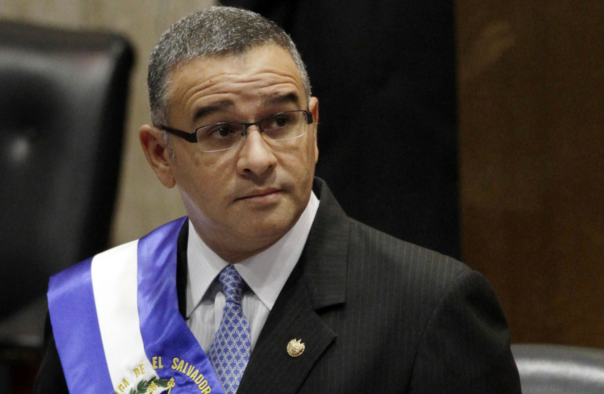 FILE - In this June 1, 2012 file photo, El Salvador's President Mauricio Funes stands in the National Assembly in San Salvador, El Salvador. Former El Salvador President Mauricio Funes, who spent the final years of his life in Nicaragua to avoid various criminal sentences, died late Tuesday. He was 65. (AP Photo/Luis Romero, File)