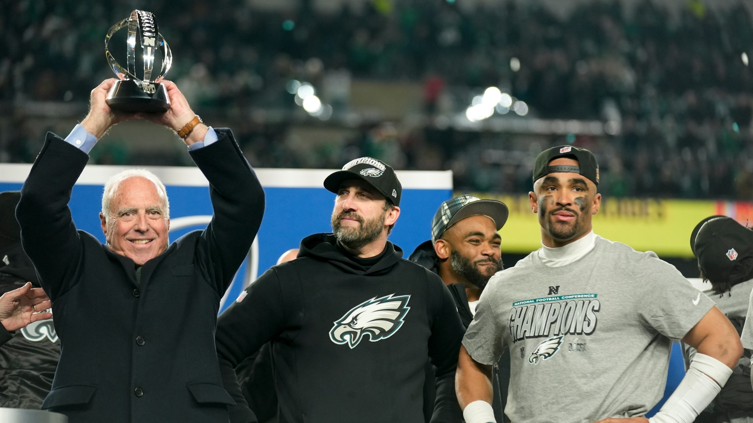 Philadelphia Eagles owner Jeffrey Lurie celebrates with the trophy after their win against the Washington Commanders in the NFC Championship NFL football game, Sunday, Jan. 26, 2025, in Philadelphia. (AP Photo/Seth Wenig)