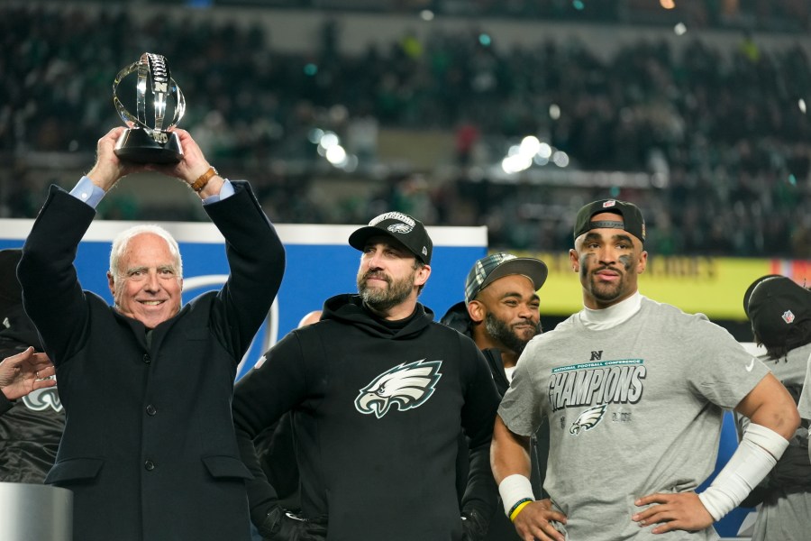 Philadelphia Eagles owner Jeffrey Lurie celebrates with the trophy after their win against the Washington Commanders in the NFC Championship NFL football game, Sunday, Jan. 26, 2025, in Philadelphia. (AP Photo/Seth Wenig)