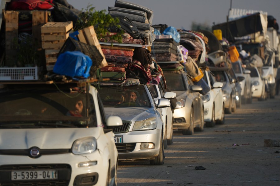 Displaced Palestinians make their way from central Gaza to their homes in the northern Gaza Strip, Wednesday, Jan. 29, 2025, after Israel began allowing hundreds of thousands of Palestinians return as part of the ceasefire deal between Israel and Hamas. (AP Photo/Abdel Kareem Hana)