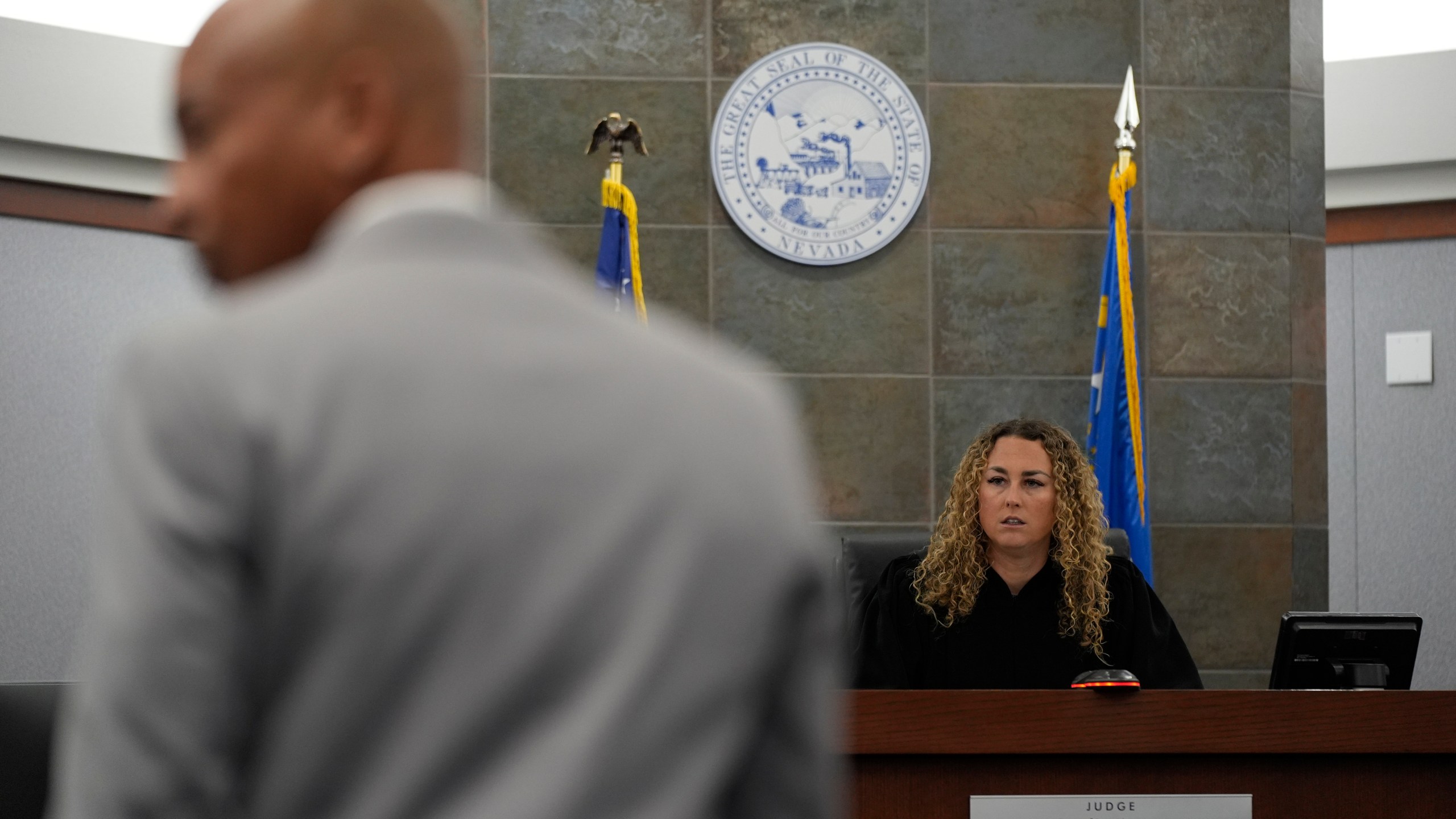 Carl E.G. Arnold, left, attorney for Duane "Keffe D" Davis, listens with District Judge Carli Kierny, right, during an appearance by Davis for for his involvement in the 1996 killing of rapper Tupac Shakur Tuesday, Feb. 18, 2025, in Las Vegas. (AP Photo/John Locher, Pool)