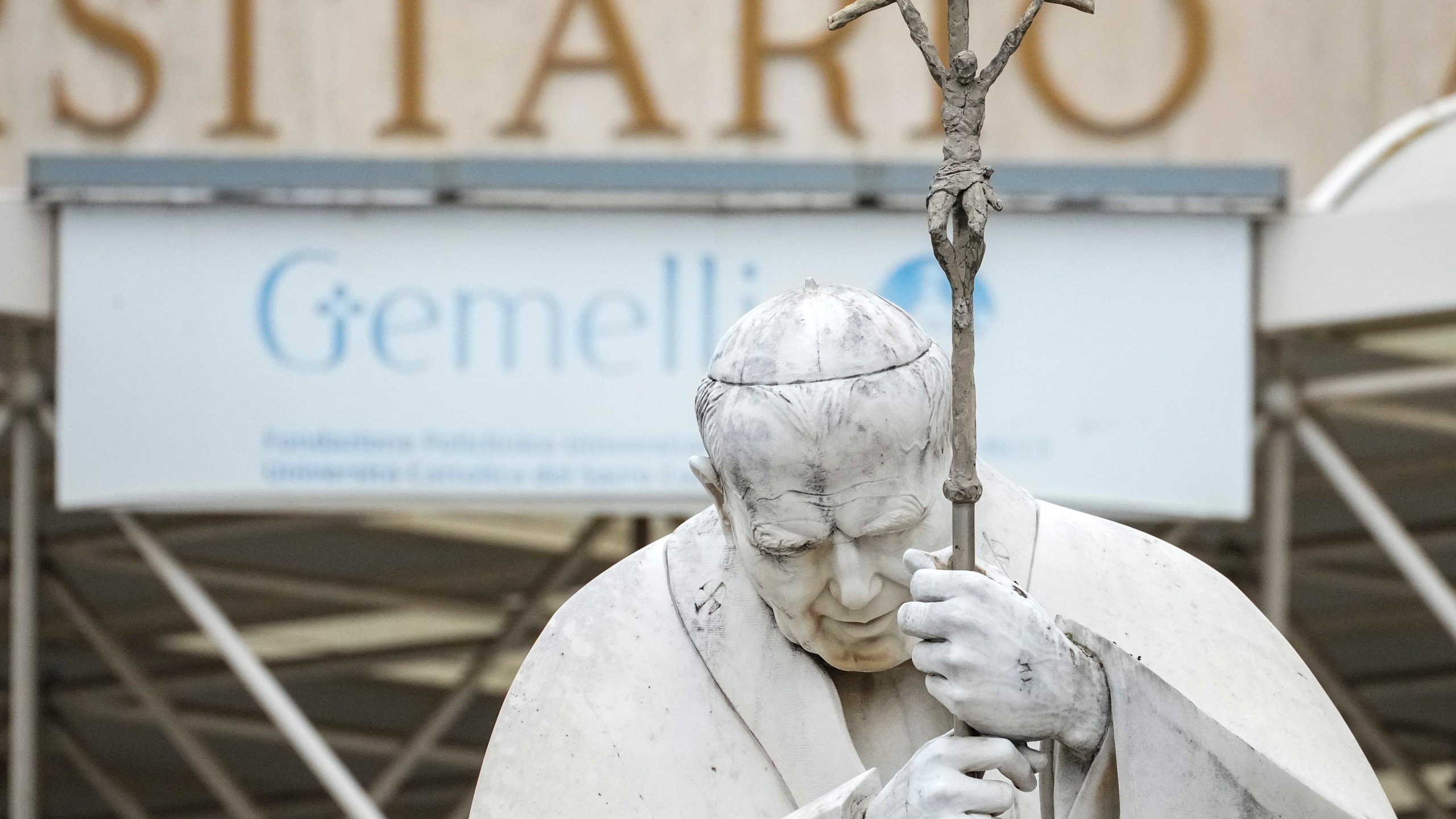 A statue of Pope John Paul II is seen in front of the Agostino Gemelli Polyclinic, in Rome, Tuesday, Feb. 18, 2025, where Pope Francis has been hospitalised to undergo some necessary diagnostic tests and to continue his ongoing treatment for bronchitis. (AP Photo/Andrew Medichini)