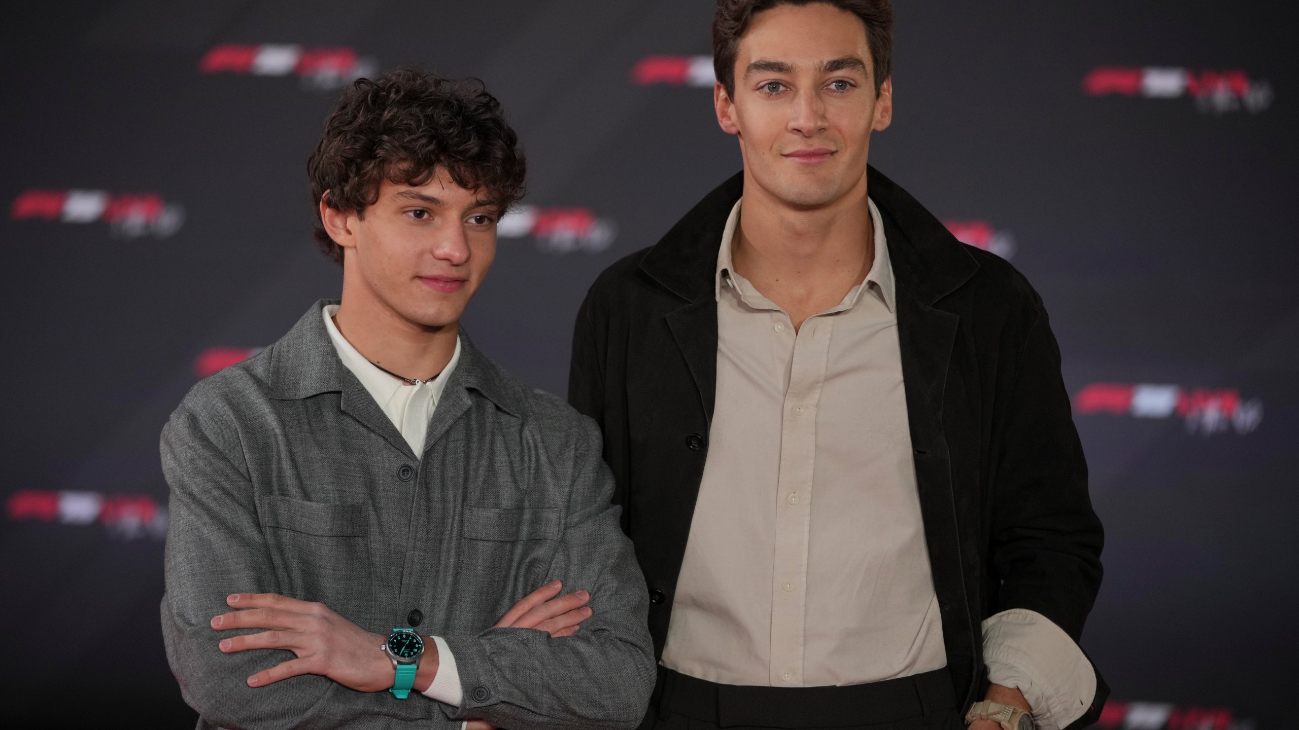 Mercedes driver Andrea Kimi Antonelli of Italy, left, and Mercedes driver George Russell of Britain, pose for cameras as they arrive to the F1 75 Live launch event at the O2 arena in London, Tuesday, Feb. 18, 2025. (AP Photo/Kin Cheung)