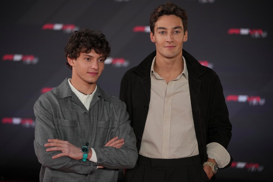 Mercedes driver Andrea Kimi Antonelli of Italy, left, and Mercedes driver George Russell of Britain, pose for cameras as they arrive to the F1 75 Live launch event at the O2 arena in London, Tuesday, Feb. 18, 2025. (AP Photo/Kin Cheung)