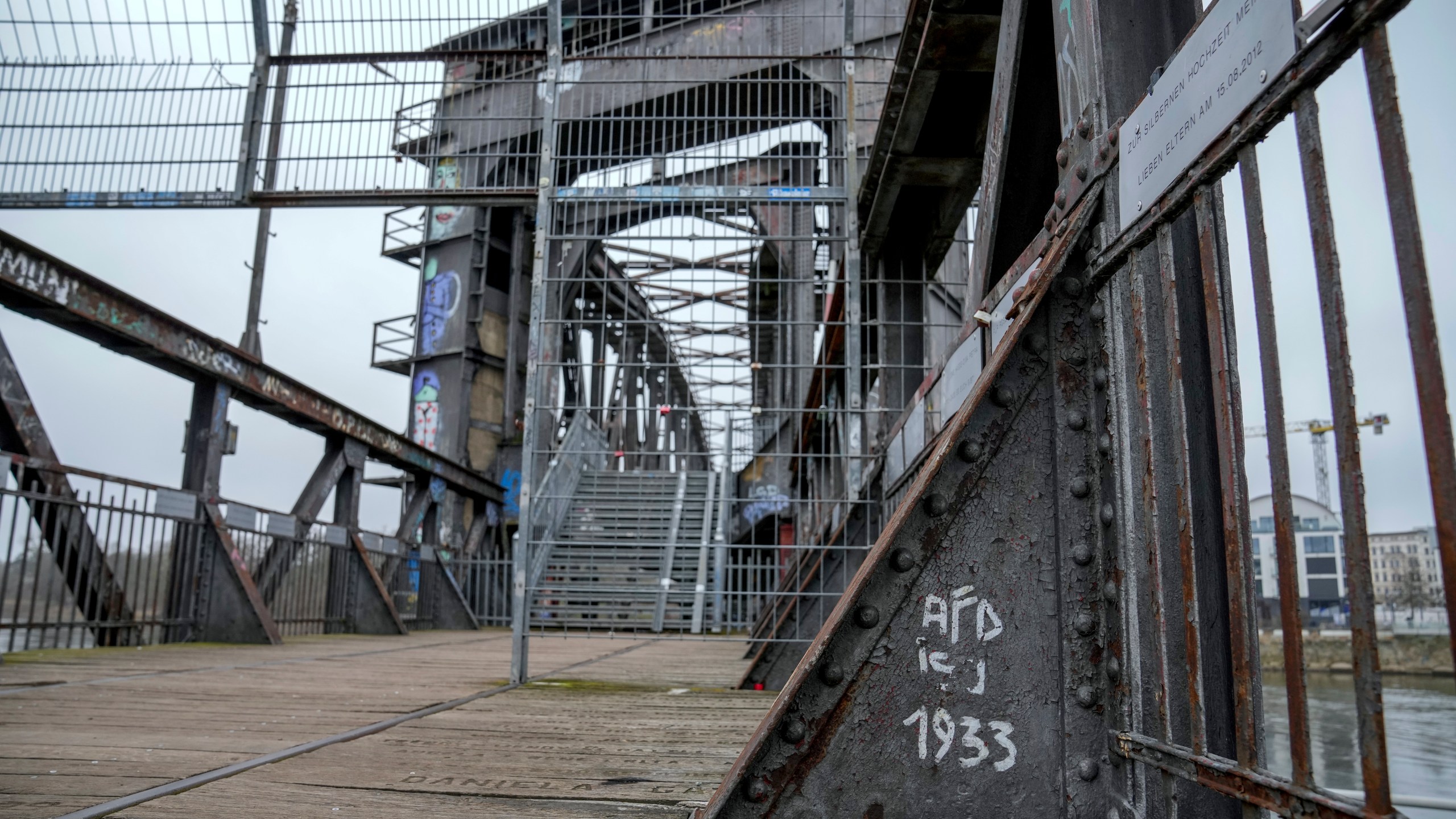 An anti AFD slogan is seen written on a bridge in the city of Magdeburg, Germany, Thursday, Feb. 6, 2025. (AP Photo/Ebrahim Noroozi)