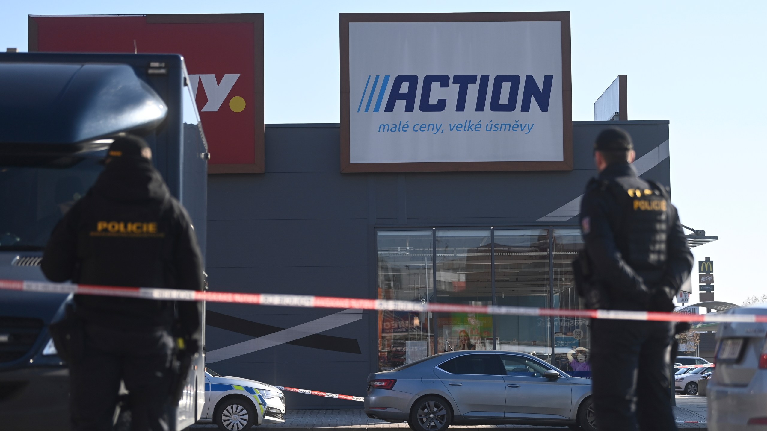 Police officers stand guard in a shopping area in Hradec Kralove, Czech Republic, at the site where two women have died in a knife attack, Thursday, Feb 20, 2025. (Josef Costarek/CTK via AP)