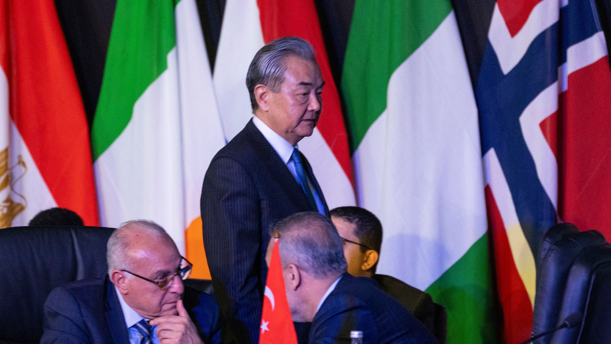 Chinese Foreign Minister Wang Yi arrives at the opening session of the G20 foreign ministers meeting in Johannesburg, South Africa, Thursday, Feb. 20, 2025. (AP Photo/Jerome Delay)