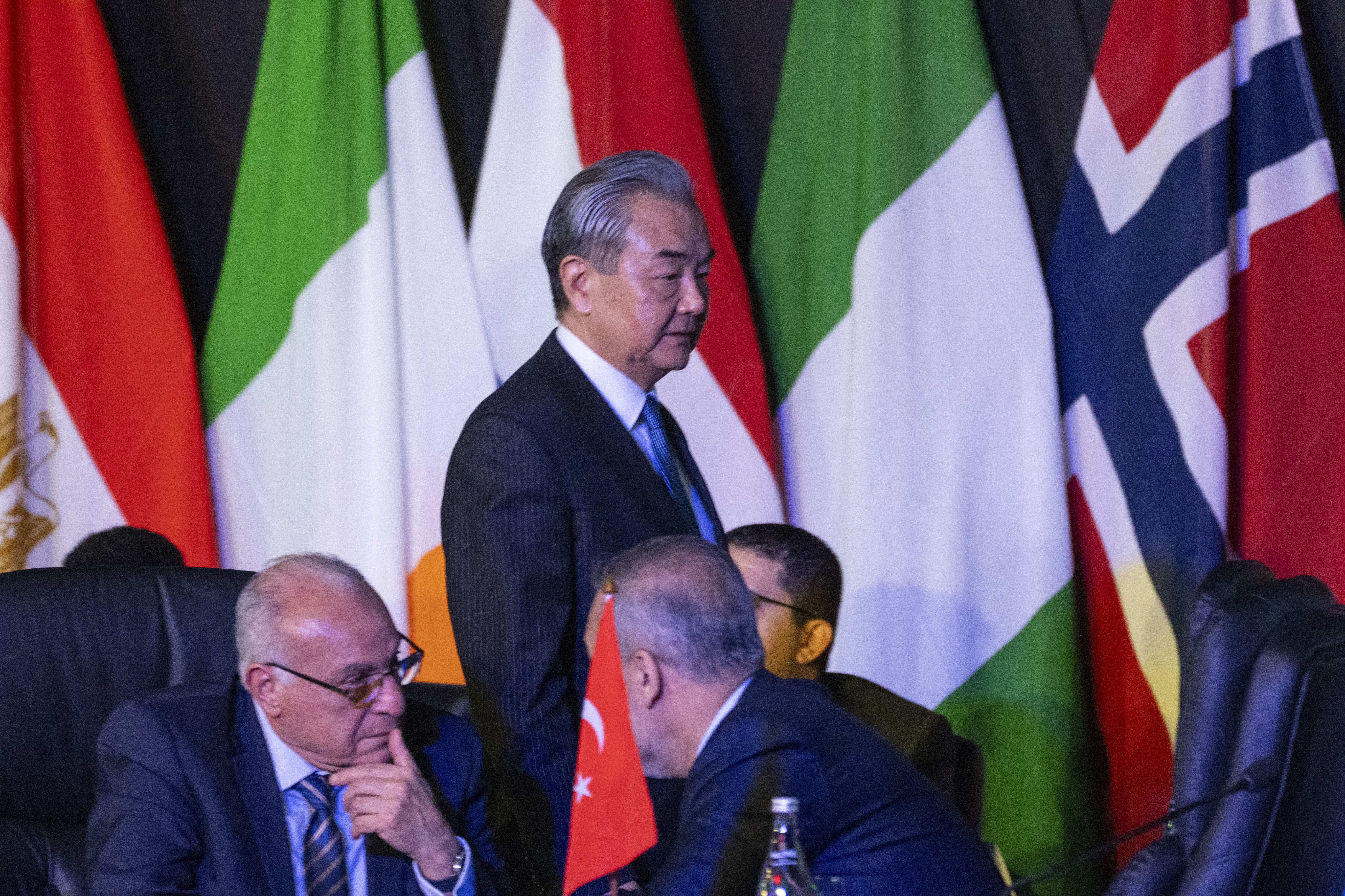 Chinese Foreign Minister Wang Yi arrives at the opening session of the G20 foreign ministers meeting in Johannesburg, South Africa, Thursday, Feb. 20, 2025. (AP Photo/Jerome Delay)