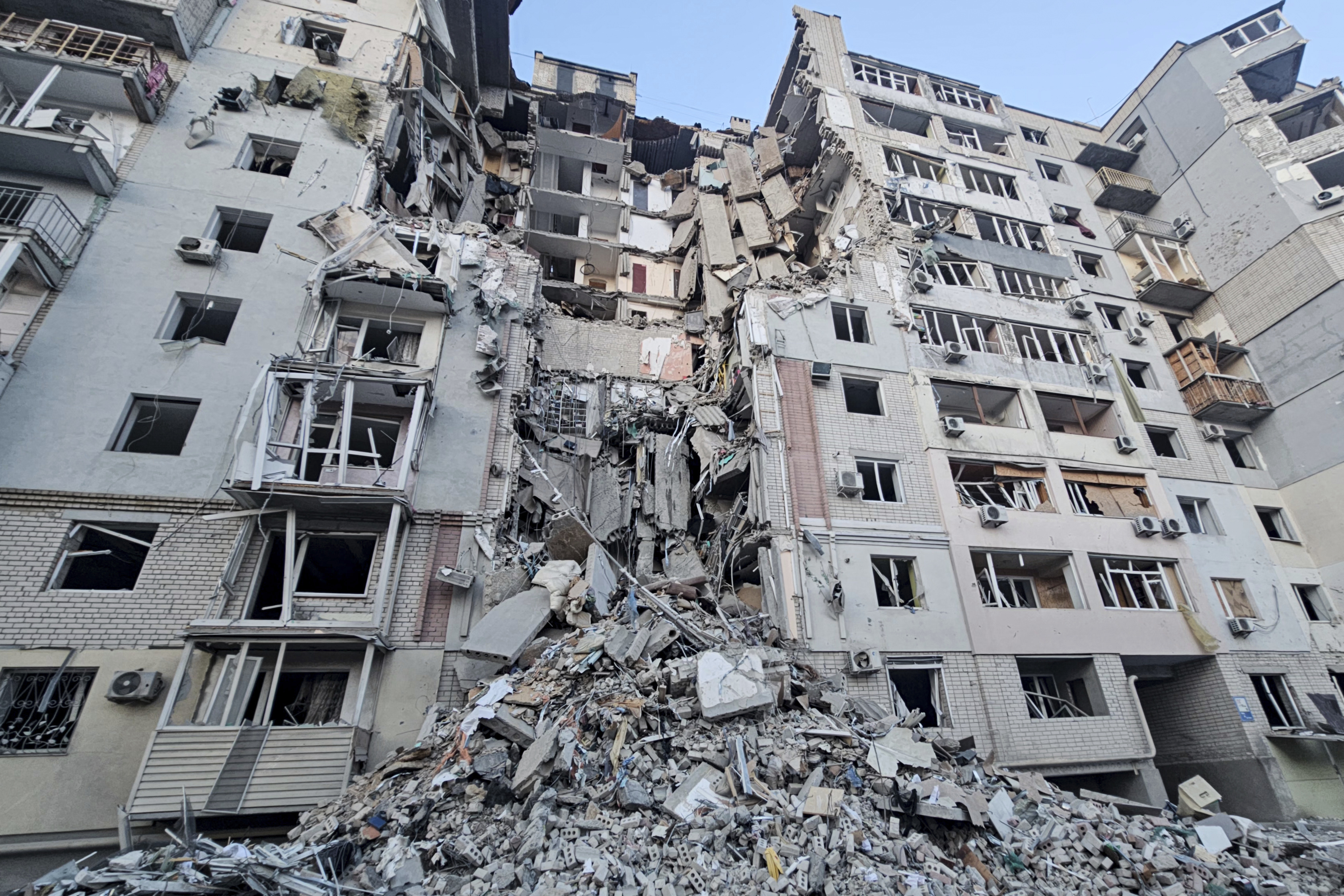 In this photo provided by the Kherson Regional Military Administration on Thursday, Feb. 20, 2025, a building is seen heavily damaged by a Russian strike in Kherson, Ukraine. (Kherson Regional Military Administration via AP)