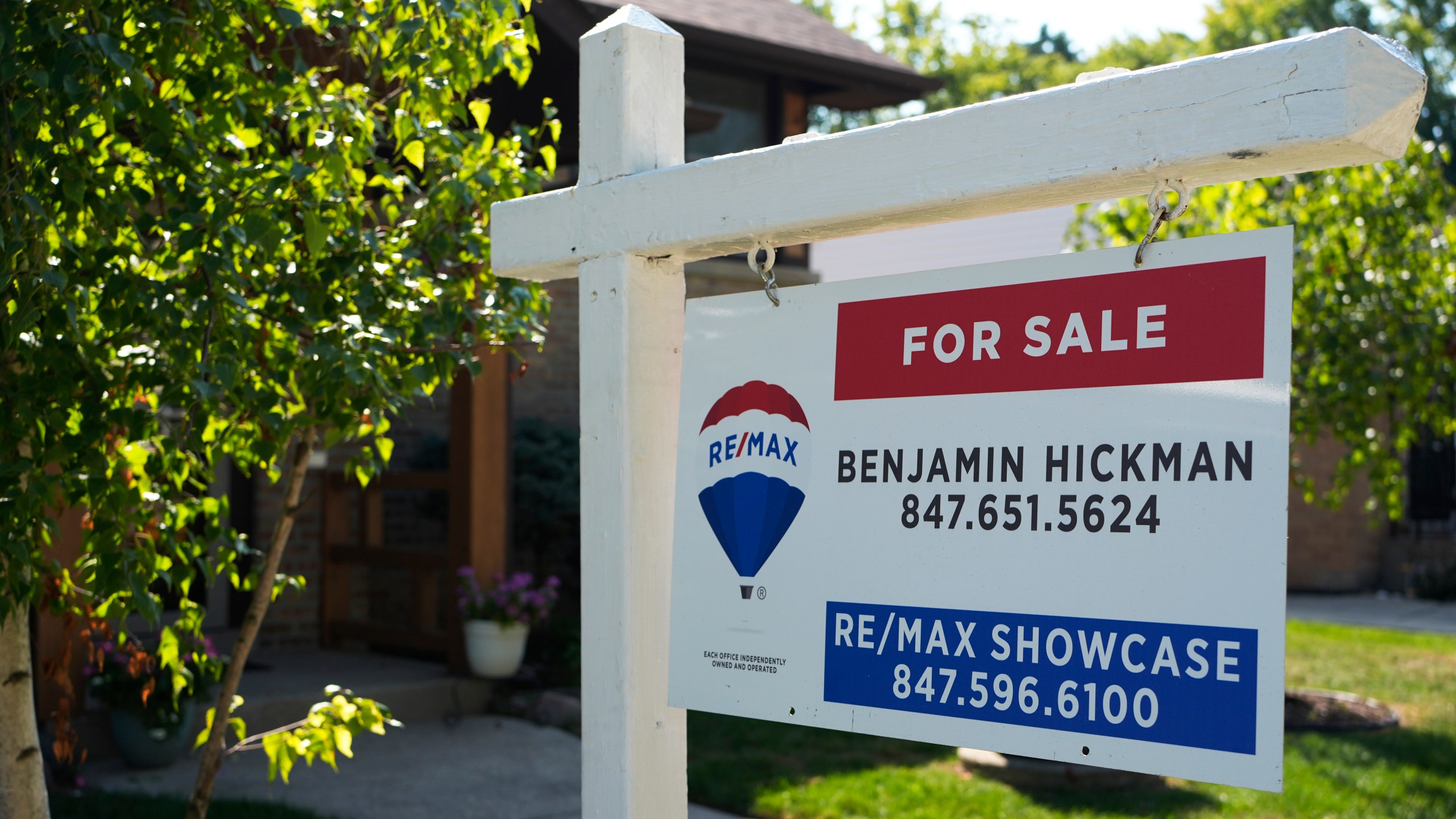 A "For Sale" sign is displayed in front of a home in Morton Grove, Ill., Sunday, Aug. 25, 2024. (AP Photo/Nam Y. Huh)