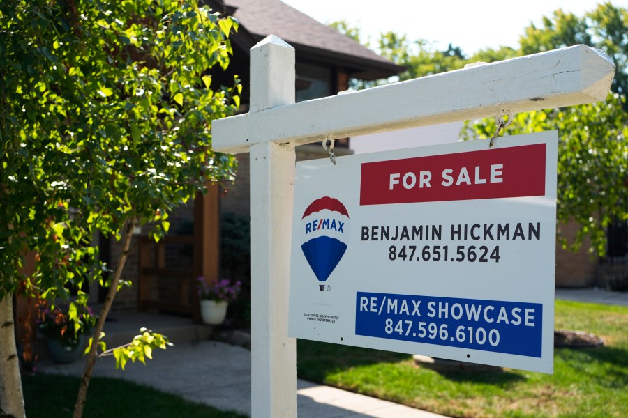 A "For Sale" sign is displayed in front of a home in Morton Grove, Ill., Sunday, Aug. 25, 2024. (AP Photo/Nam Y. Huh)