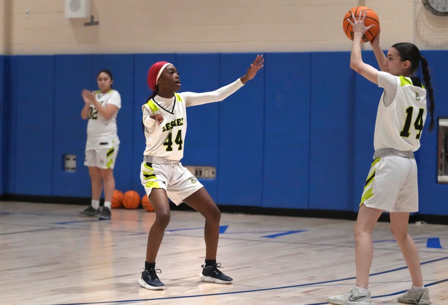 Lesley University basketball player Baileigh Sinaman-Daniel (44) pressures teammate Leila Chisholm while practicing prior to game, Tuesday, Feb. 11, 2025, in Lexington, Mass. (AP Photo/Charles Krupa)