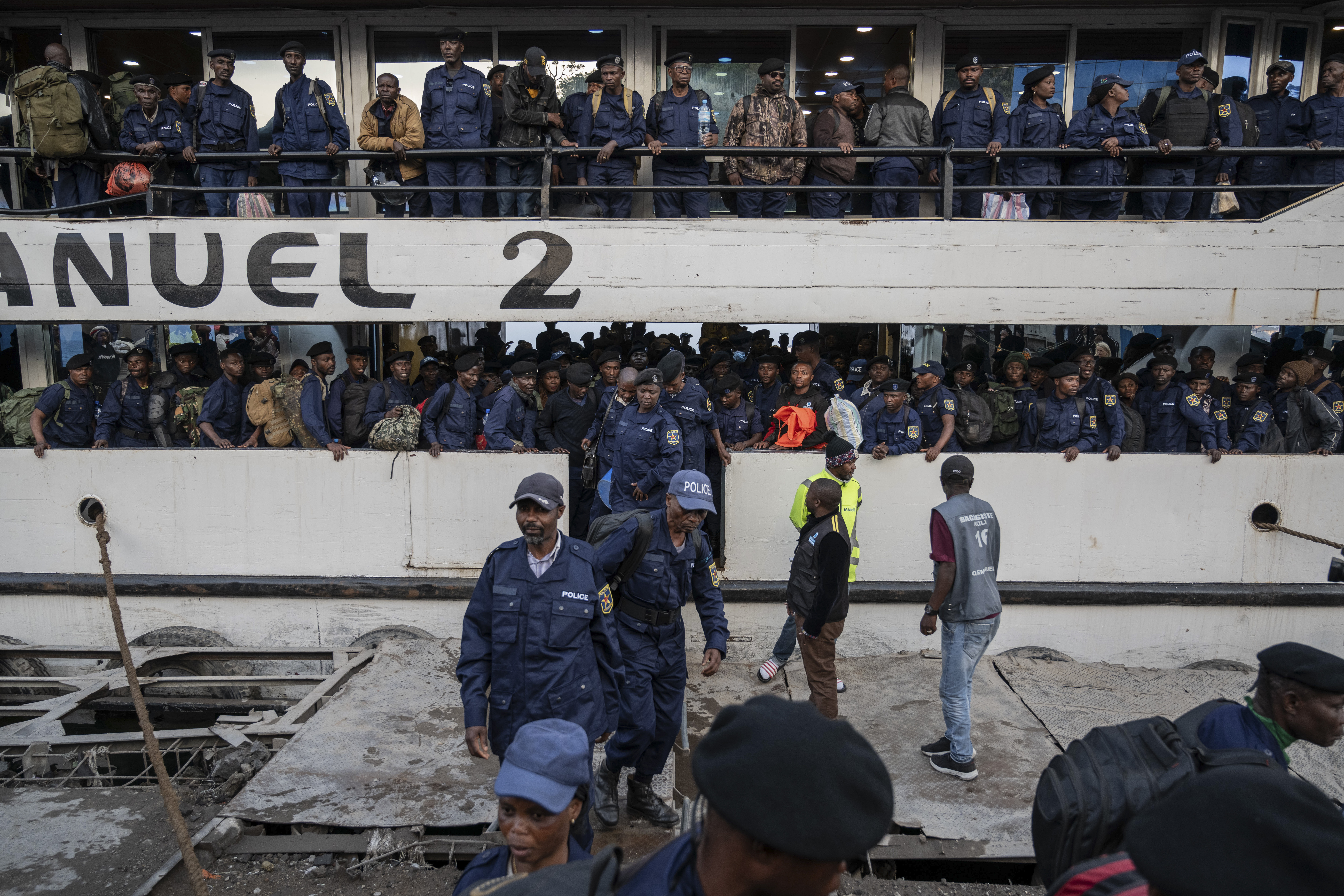 Former members of the Armed Forces of the Democratic Republic of Congo (FARDC) and police officers who allegedly surrendered to M23 rebels arrive in Goma, Congo, Sunday, Feb. 23, 2025. (AP Photo/Moses Sawasawa)