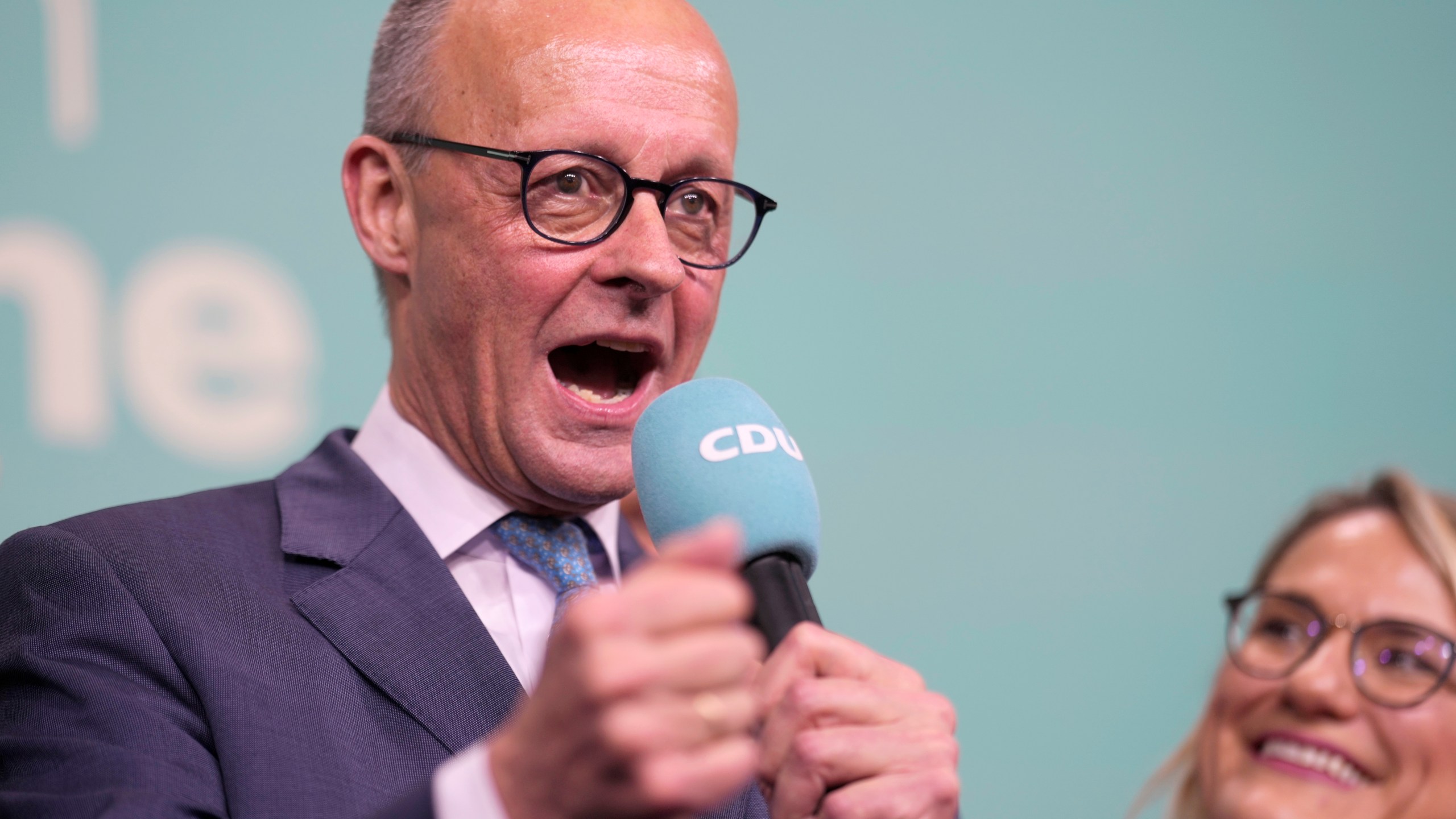 Friedrich Merz, the candidate of the mainstream conservative Christian Democratic Union party, gestures while addressing supporters at the party headquarters in Berlin, Germany, Sunday, Feb. 23, 2025, after the German national election. (AP Photo/Markus Schreiber)