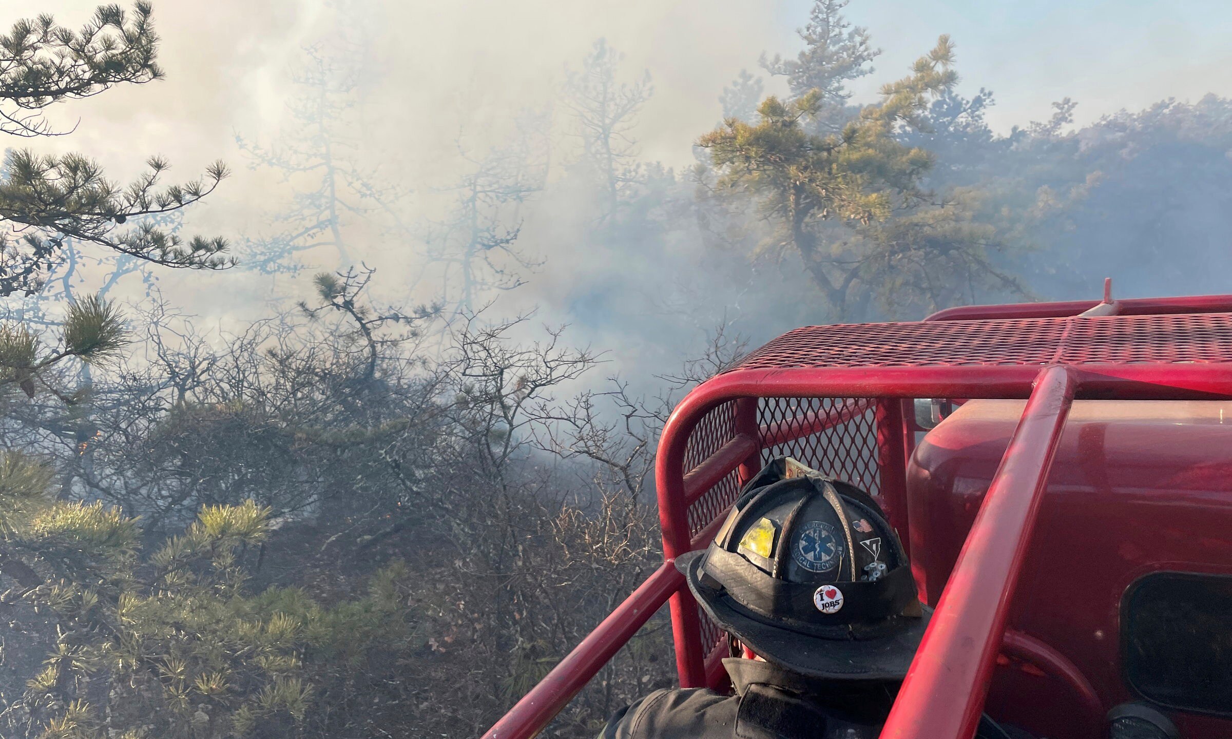 Firefighters respond to a brush fire in Suffolk County in New York's Long Island on Saturday, March 8, 2025. (Steve Pfost/Newsday via AP)