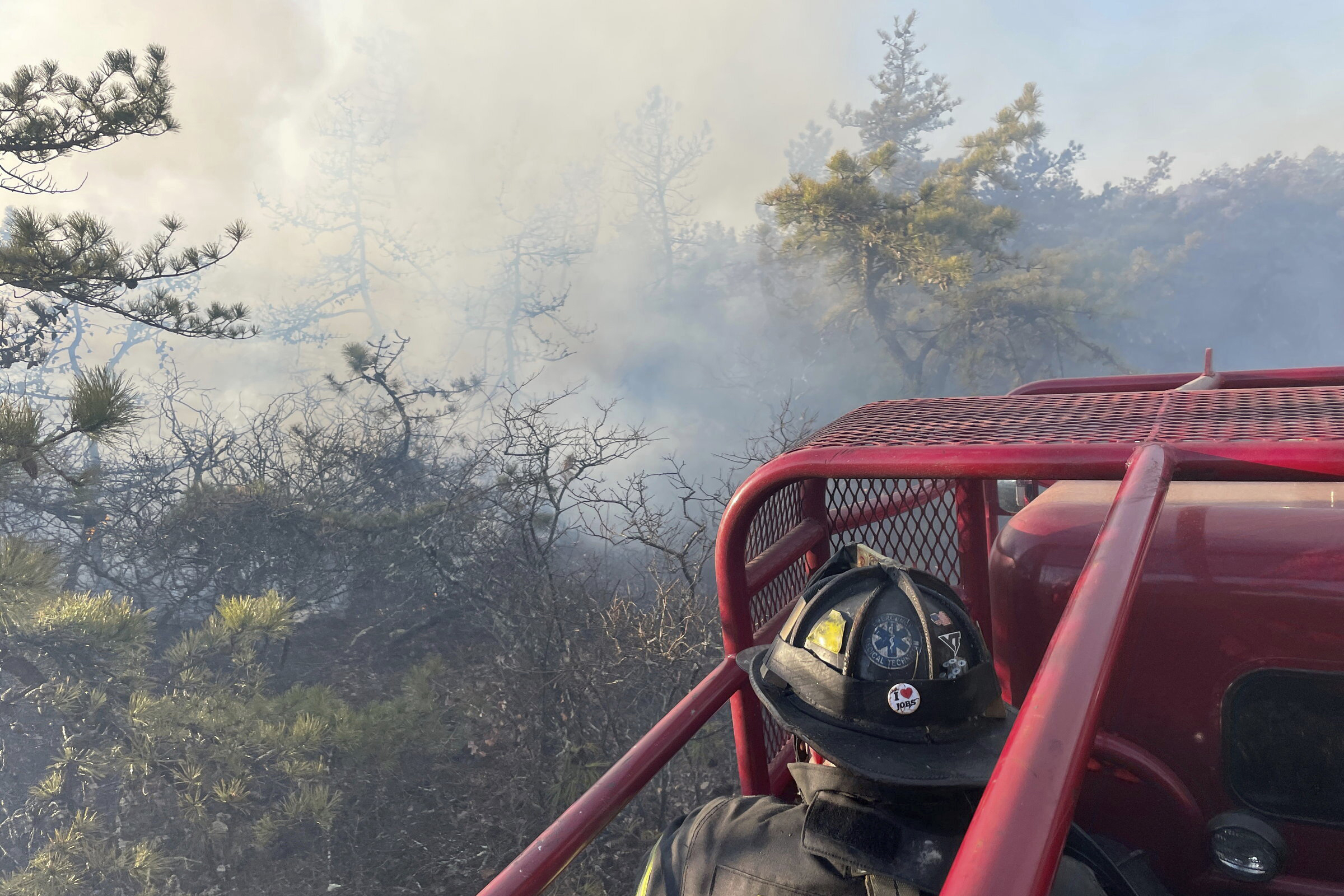 Firefighters respond to a brush fire in Suffolk County in New York's Long Island on Saturday, March 8, 2025. (Steve Pfost/Newsday via AP)