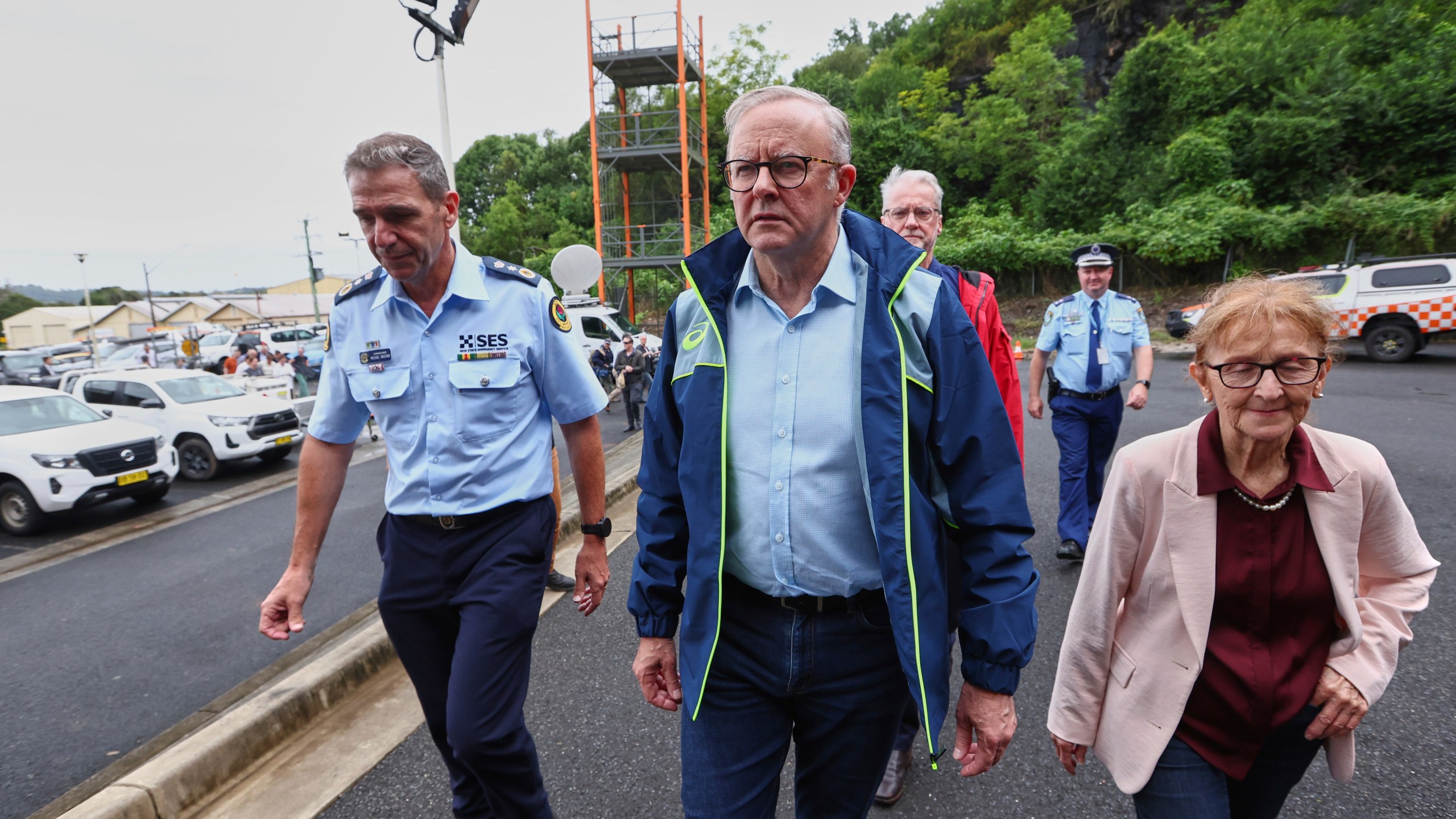 Australian Prime Minister Anthony Albanese, centre, arrives at a State Emergency Service centre in Lismore, Australia, Monday, March 10, 2025. (Jason O'Brien/AAP Image via AP)