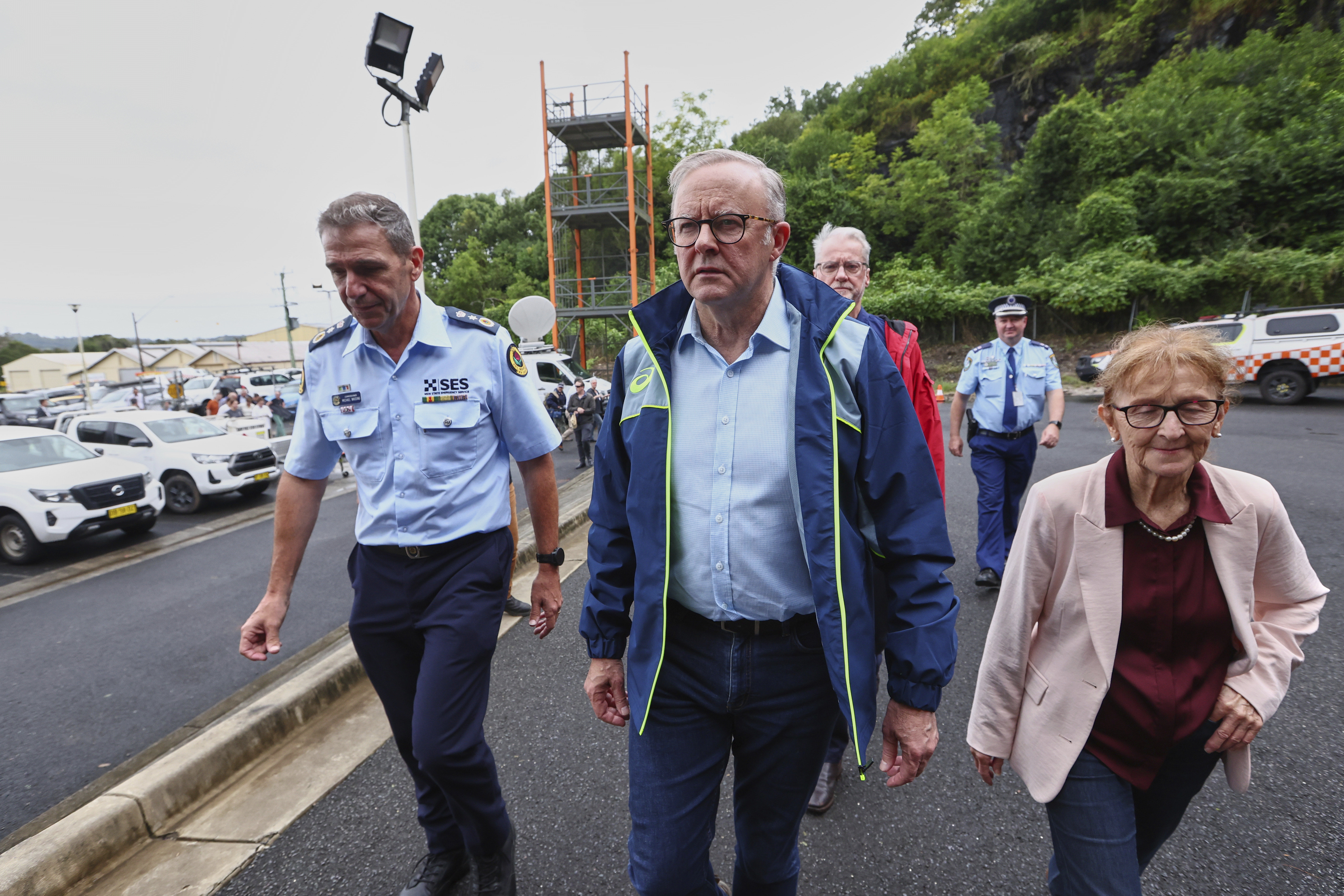 Australian Prime Minister Anthony Albanese, centre, arrives at a State Emergency Service centre in Lismore, Australia, Monday, March 10, 2025. (Jason O'Brien/AAP Image via AP)