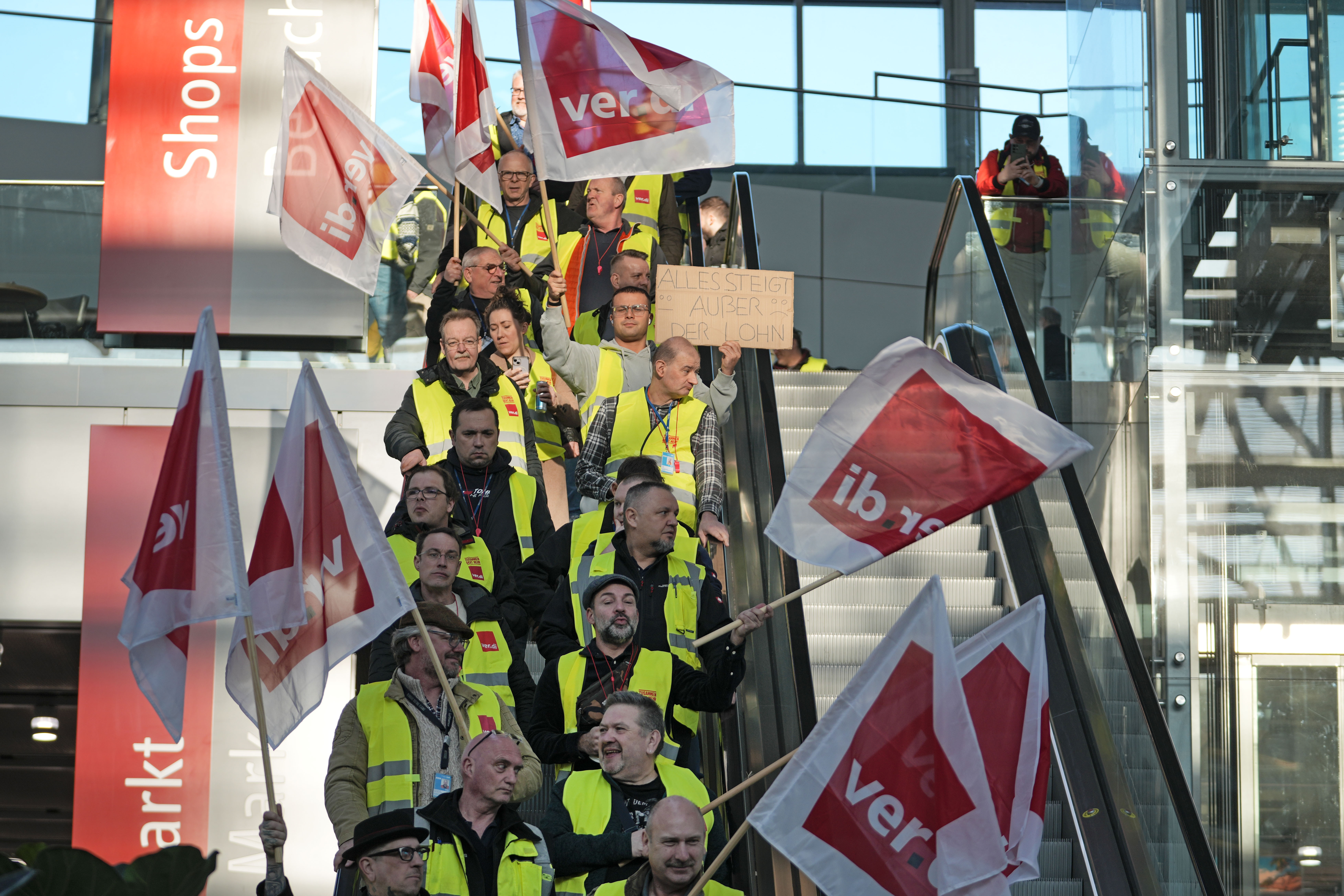 Airport workers protest during a strike of the union ver.di at the airport in Duesseldorf, Germany on Monday, March 10, 2025, when all major airports in Germany went on a warning strike. (AP Photo/Martin Meissner)