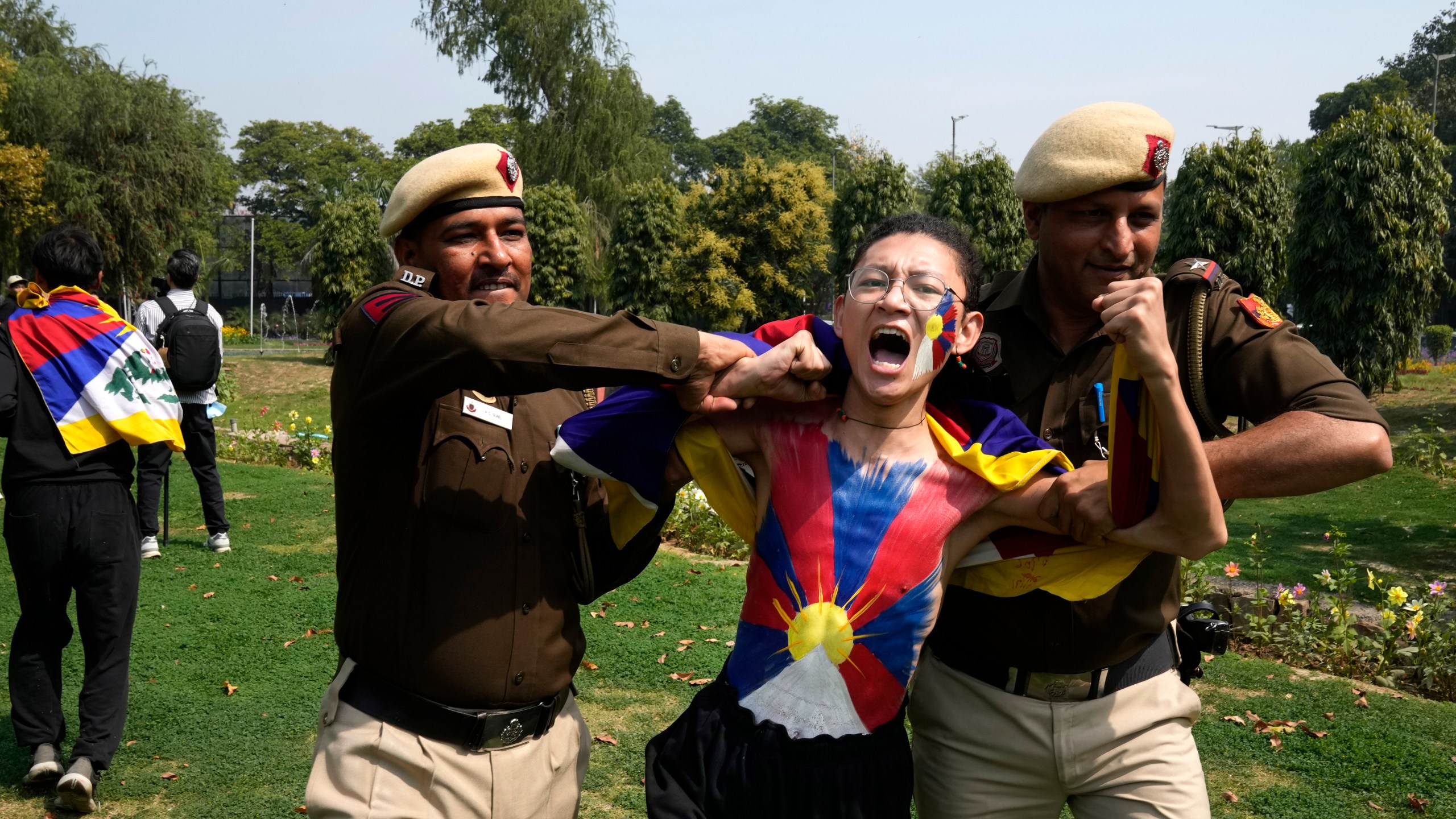 Police try to detain a protesting exile Tibetan during a protest outside Chinese embassy to mark the 1959 uprising in Tibet against the Chinese rule on this day, in New Delhi,India, Monday, March, 10, 2025. (AP Photo/Manish Swarup)